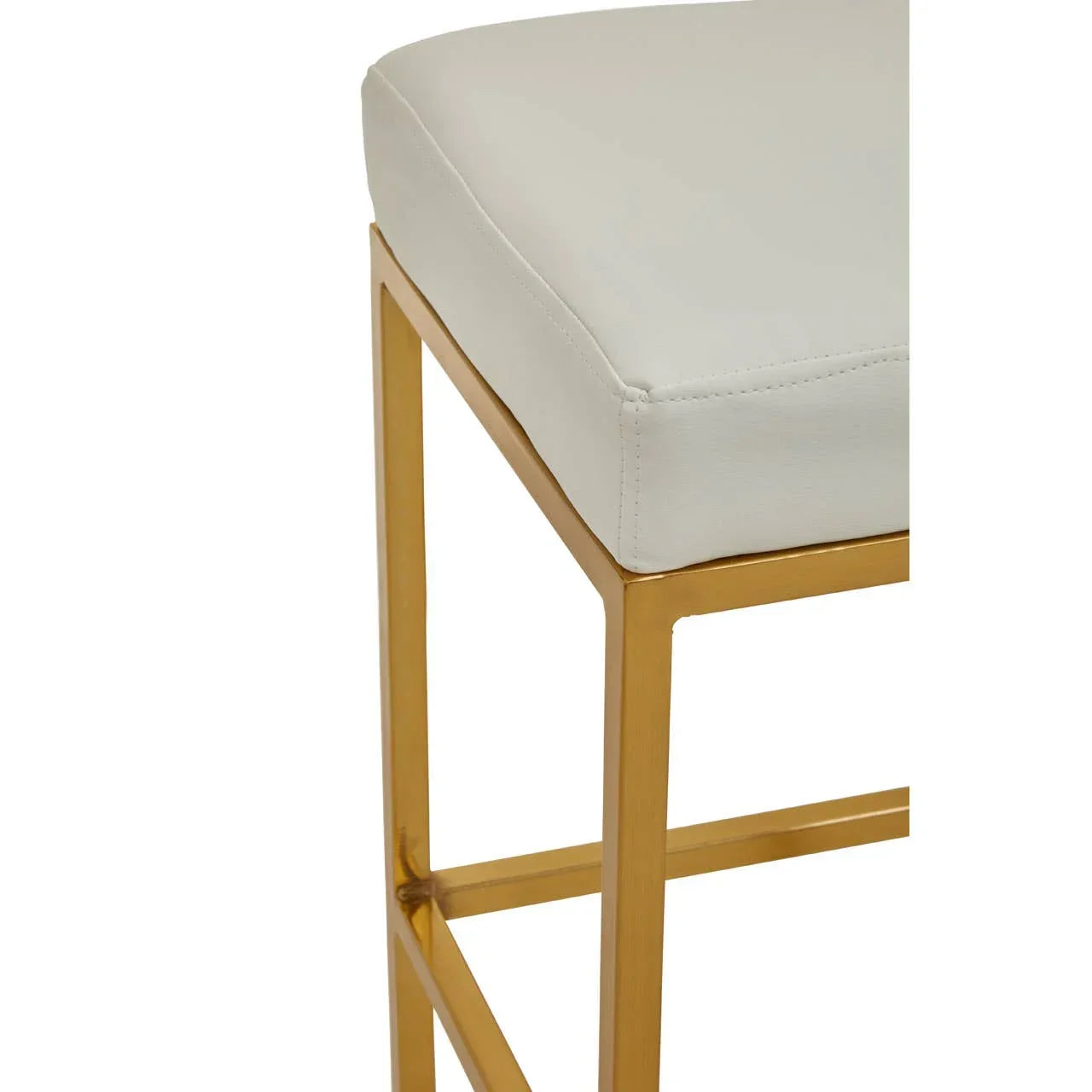 Cream cushioned bar stool with gold metal frame close-up
