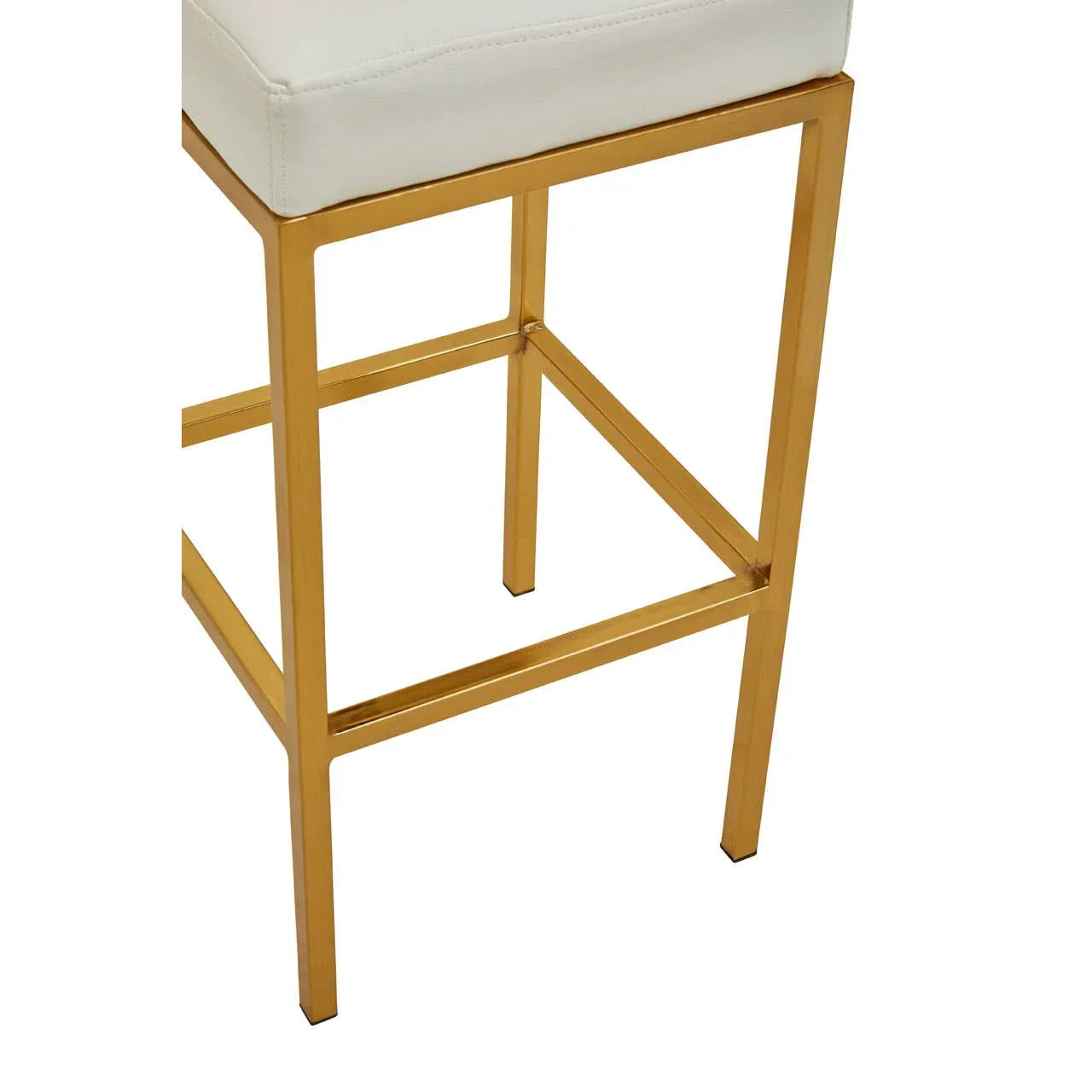 Gold metal bar stool base with white cushioned seat, close up of legs and frame