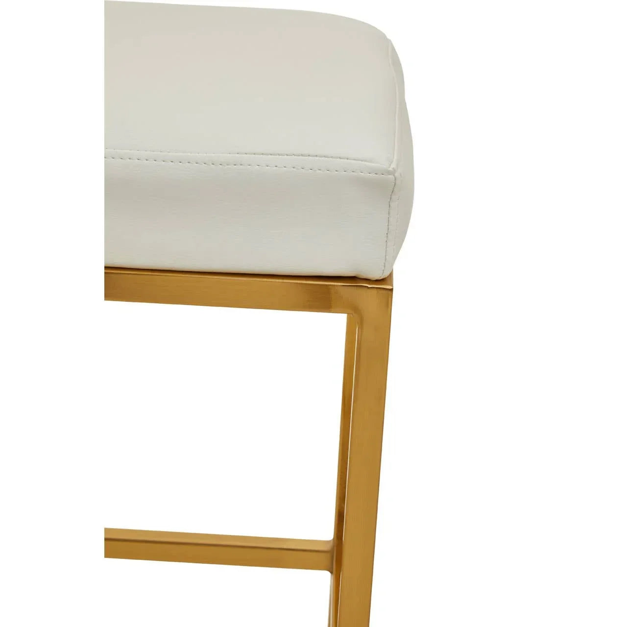 Close view of white cushioned seat with gold metal frame, modern dining chair corner
