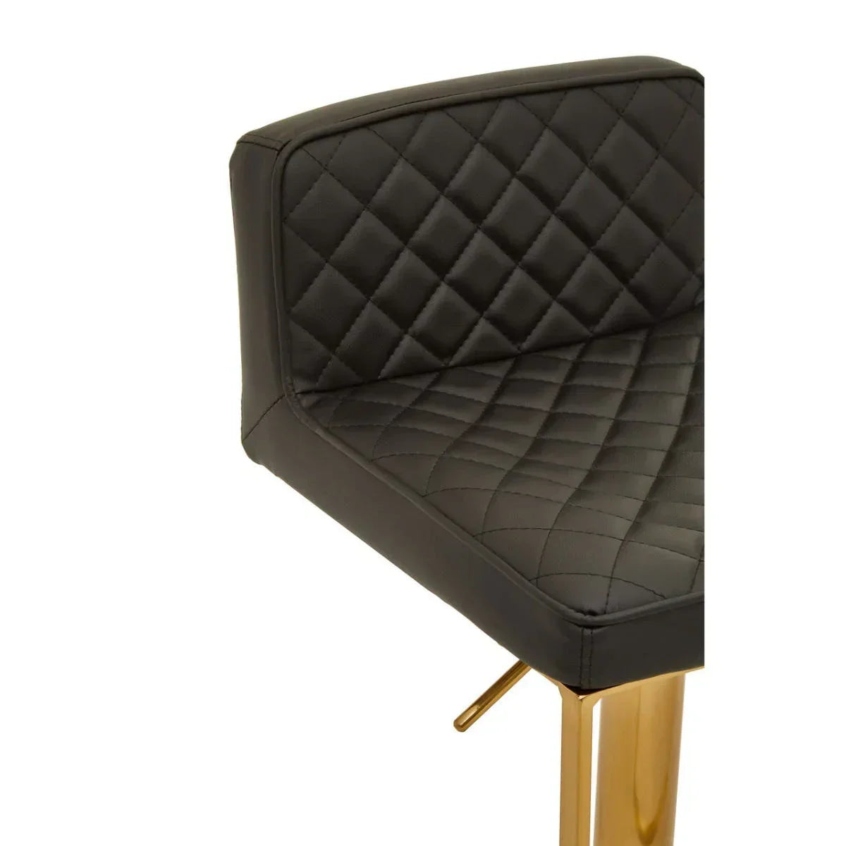 Quilted black leather bar stool with gold metal legs, close-up of seat and backrest