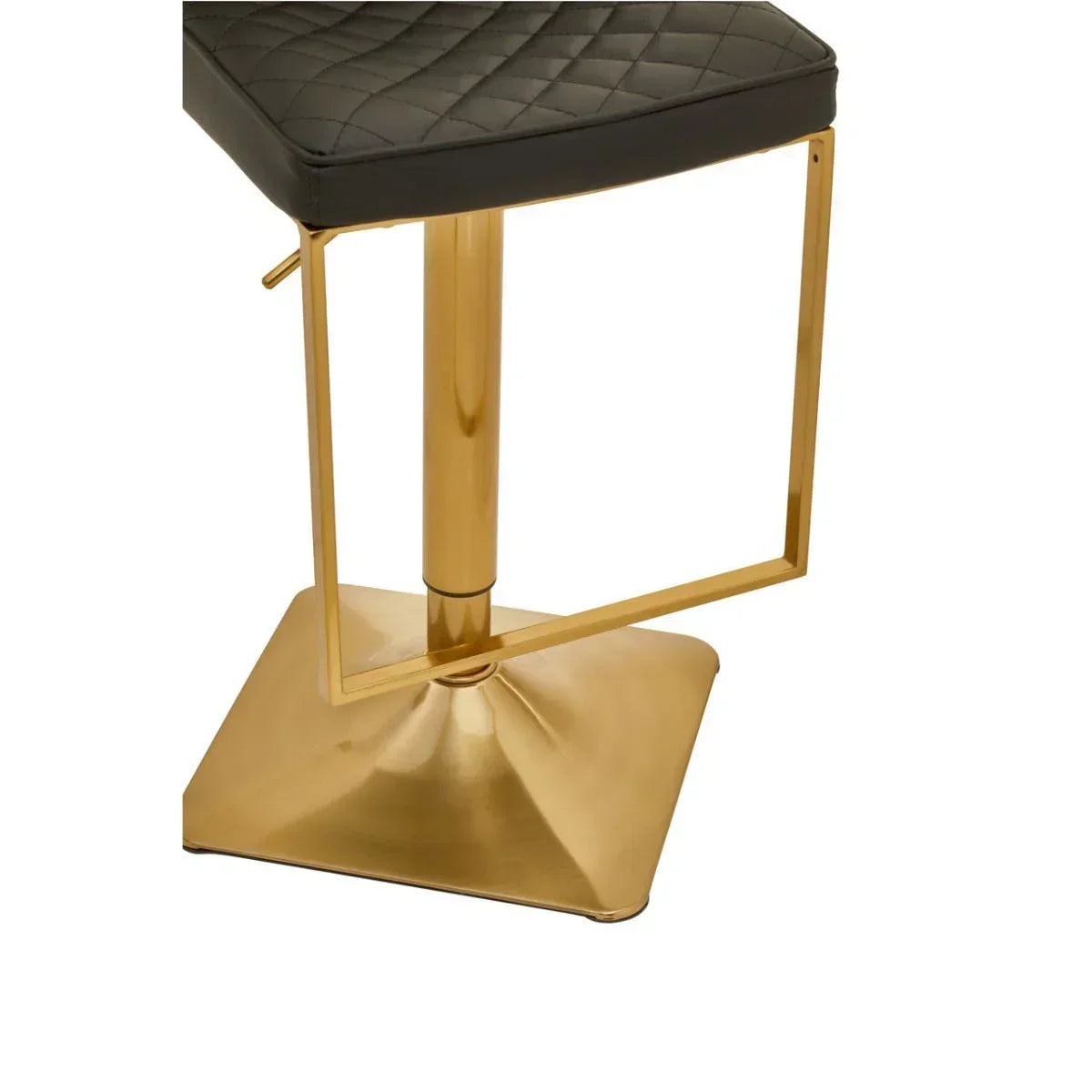 Bar stool with black quilted seat and gold metal base, closeup view
