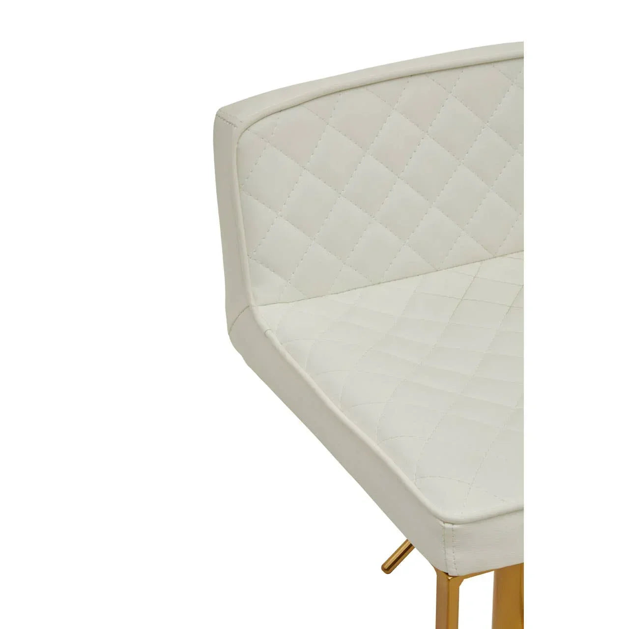 White quilted dining chair with gold metal legs, close up of seat and backrest corner