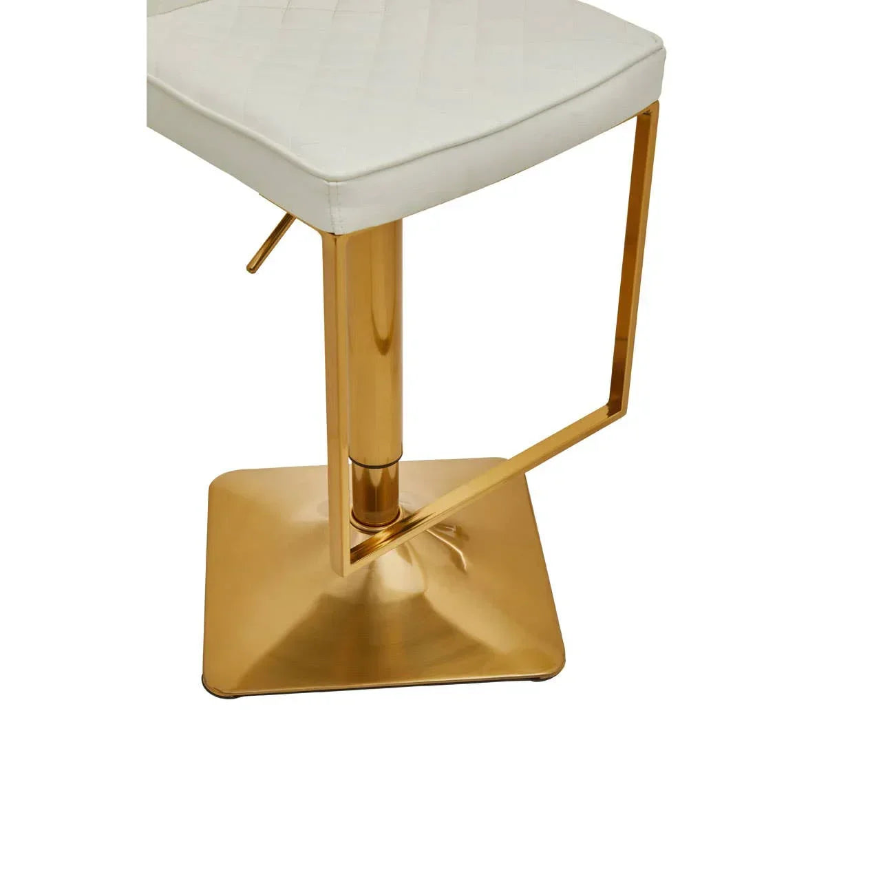 White bar stool with gold metal base and footrest, close-up of seat and stand