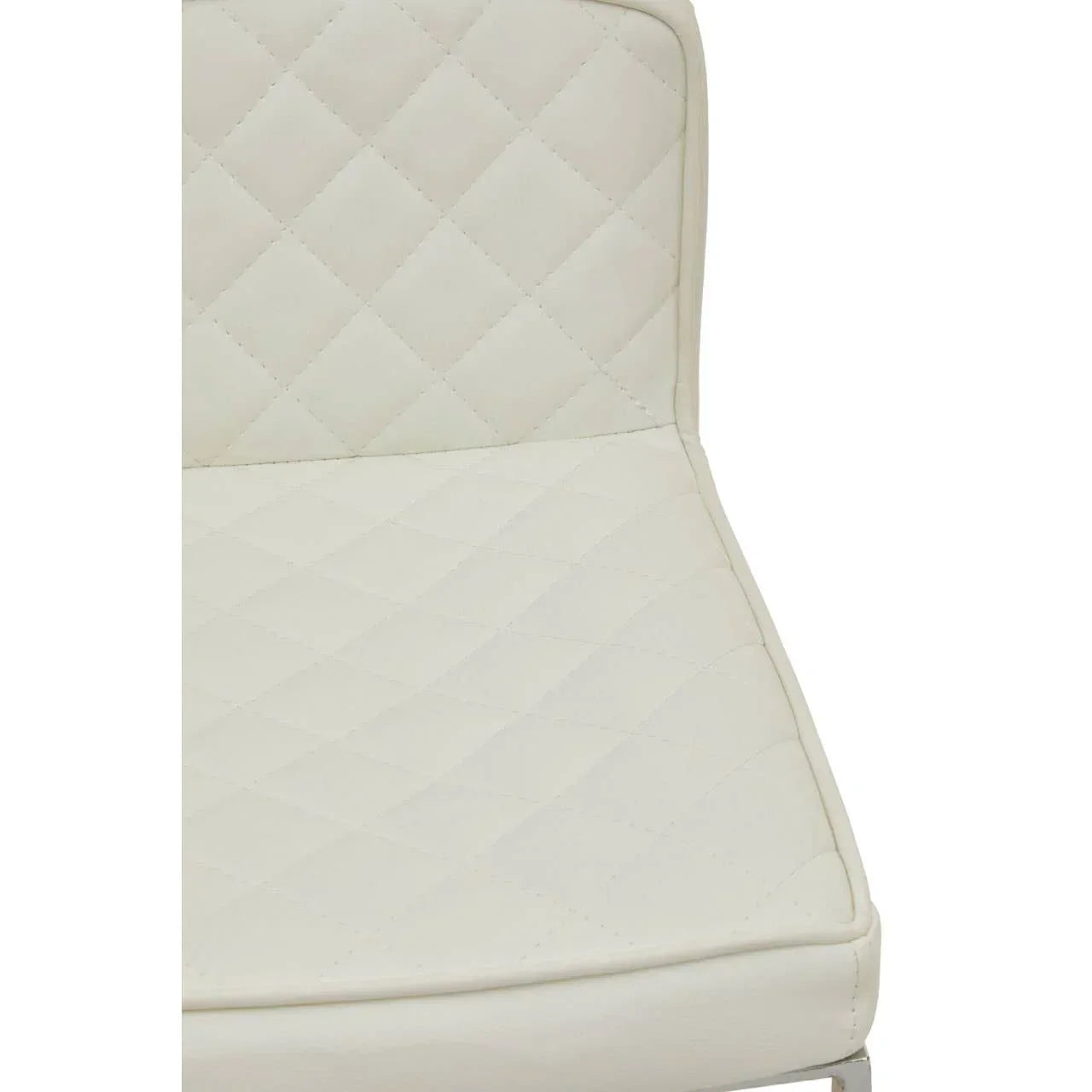 Closeup of cream faux leather dining chair seat with diamond stitching detail