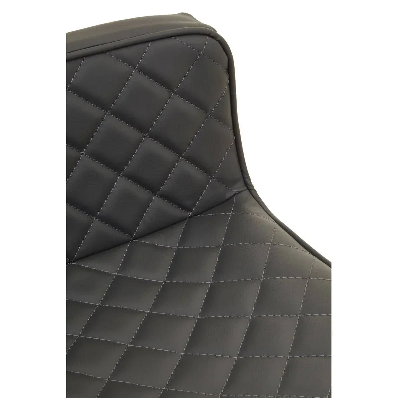 Close up of black faux leather chair with diamond quilted stitching on the backrest