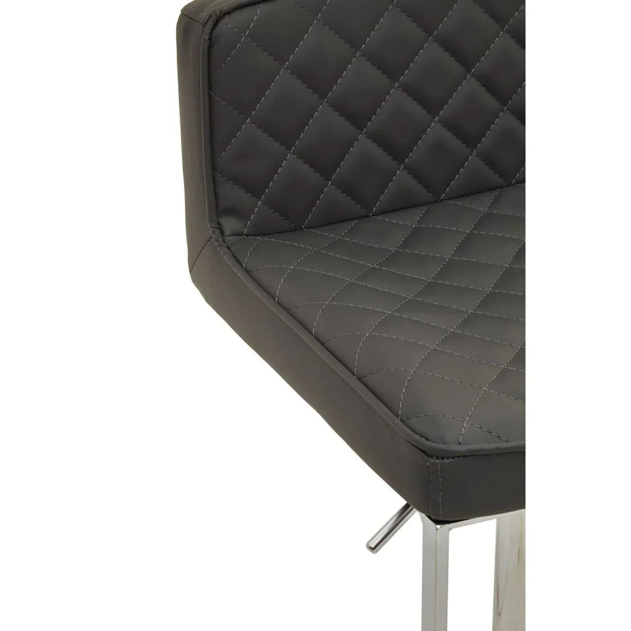 Quilted black faux leather dining chair with chrome legs, close-up of seat and backrest
