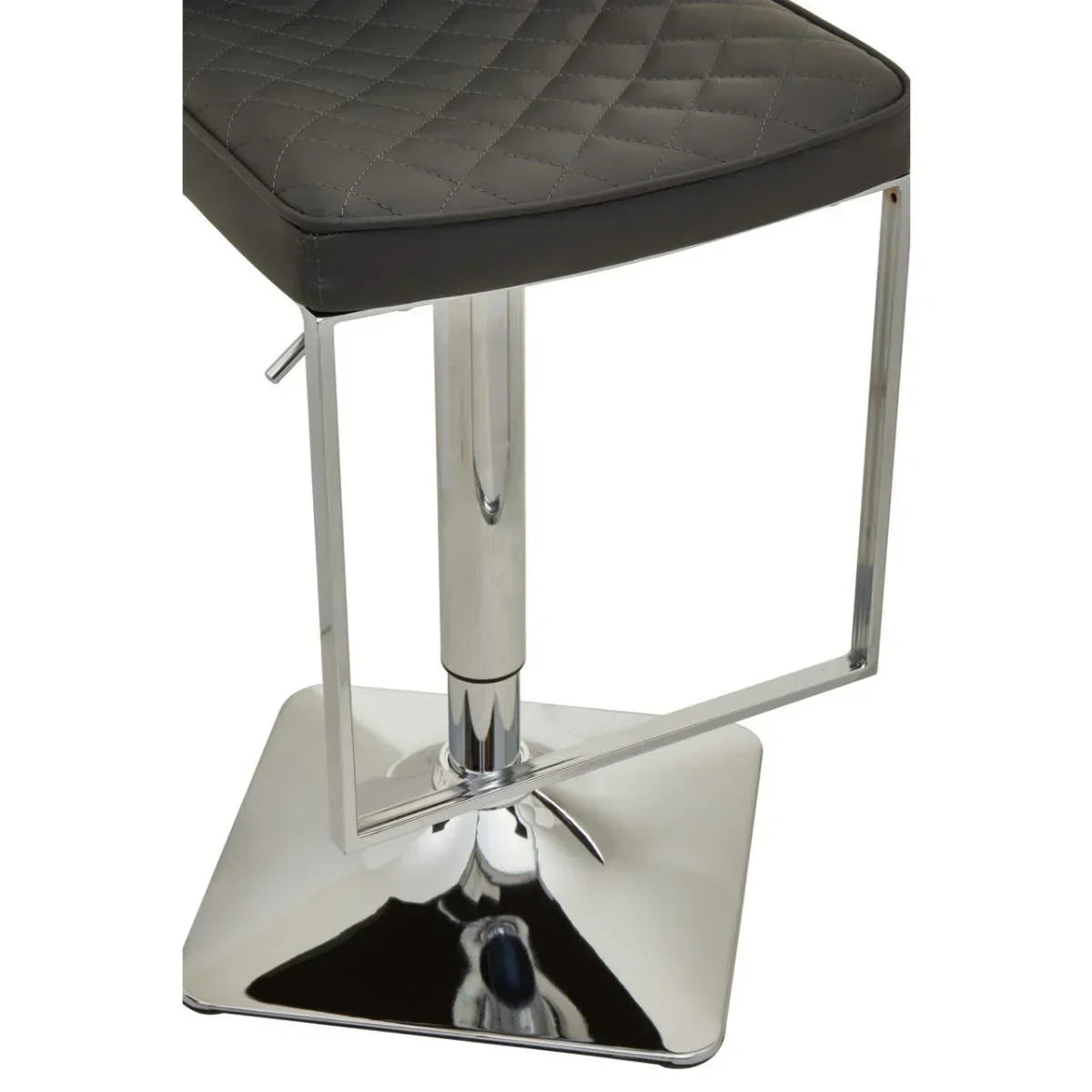 Grey bar stool with quilted seat, chrome base, and metal footrest close-up