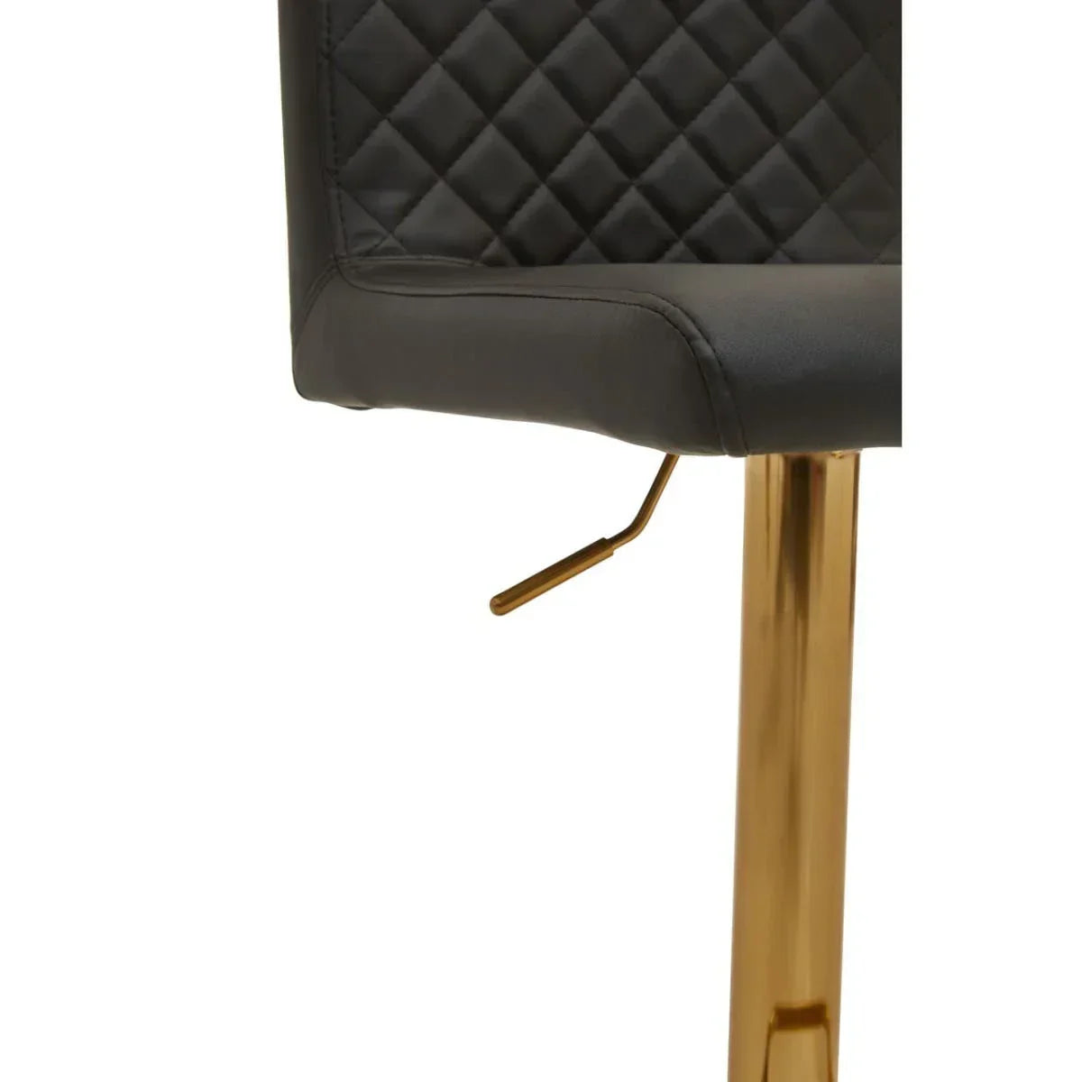 Black quilted bar stool seat with gold metal base and adjustable lever close-up
