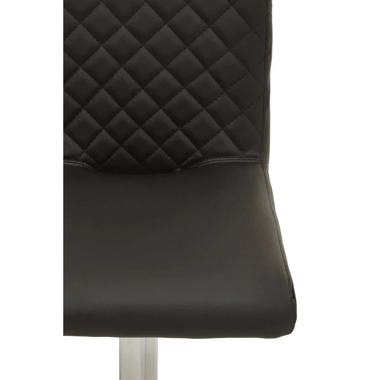 Black leather dining chair closeup with quilted back and chrome leg detail