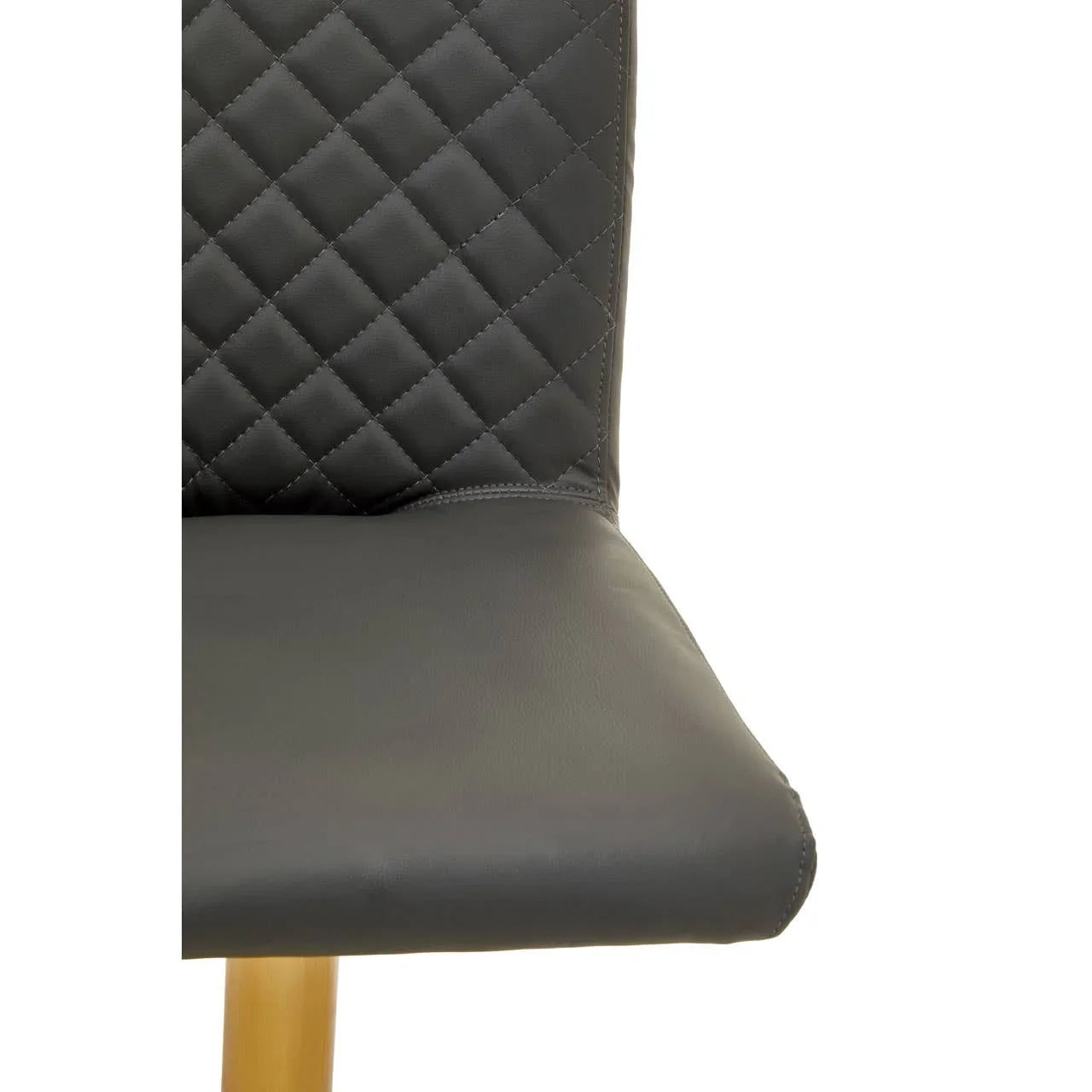 Black faux leather dining chair with quilted backrest and wooden leg detail, close view