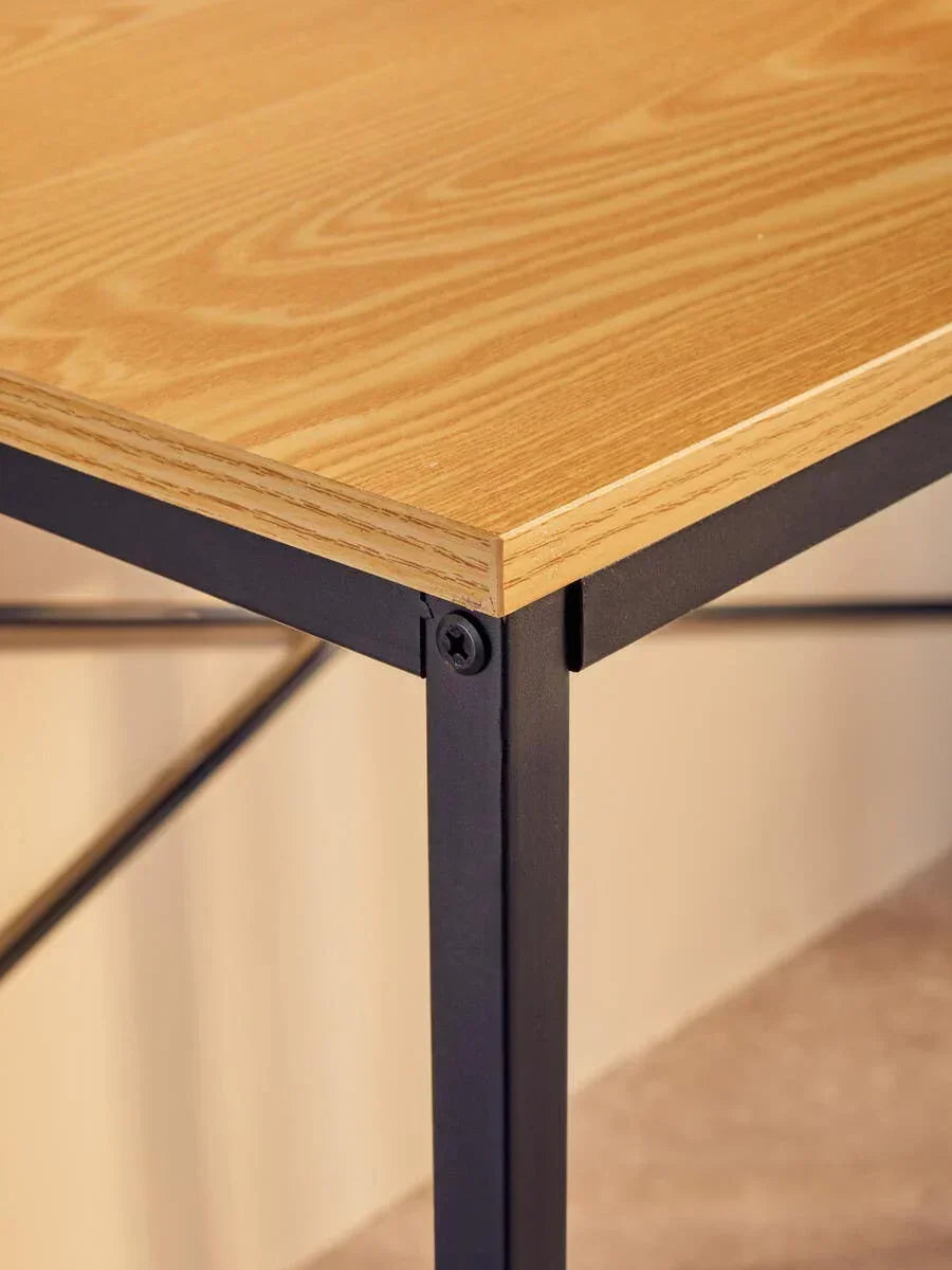 Oak effect dining table corner with black metal frame and natural wood grain detail