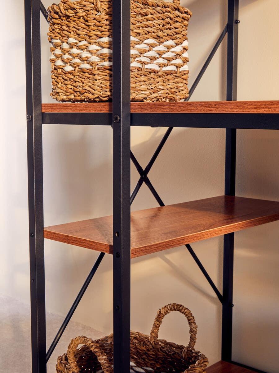Industrial shelving unit with wood shelves and woven baskets for storage