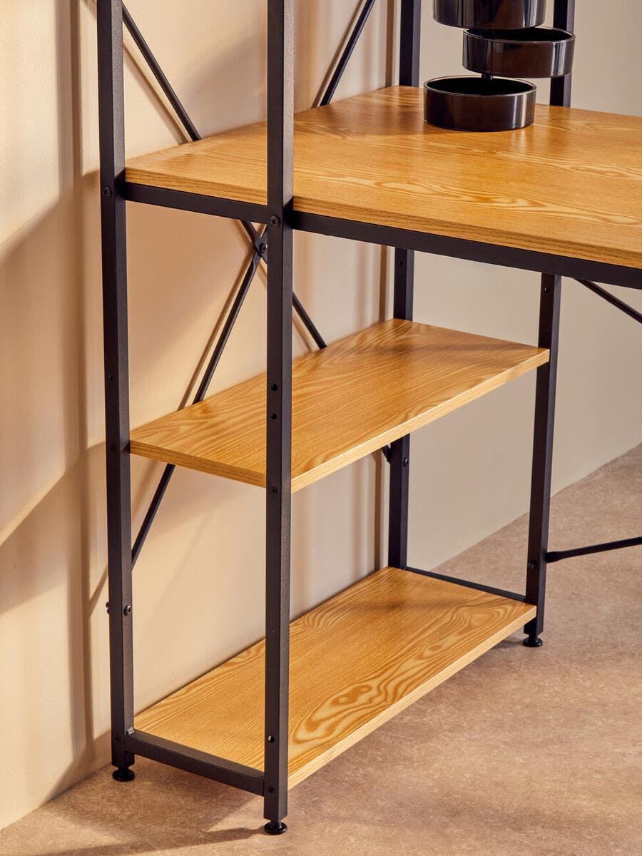 Wood and metal shelving unit with three shelves against a beige wall