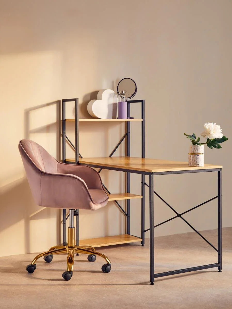 Wooden desk with black metal frame and shelves, paired with pink velvet office chair