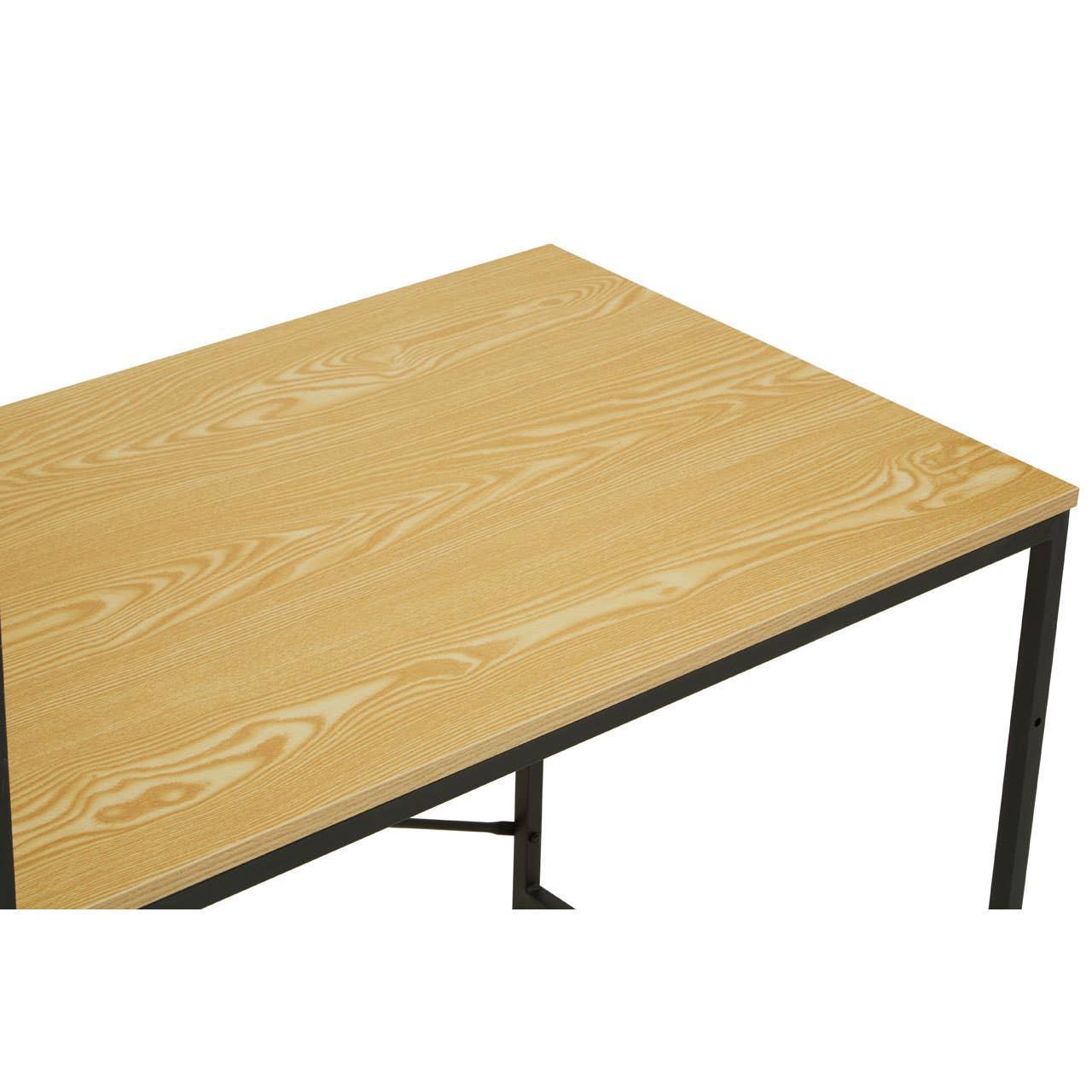 Light wood dining table with black metal legs, close-up of tabletop and corner frame