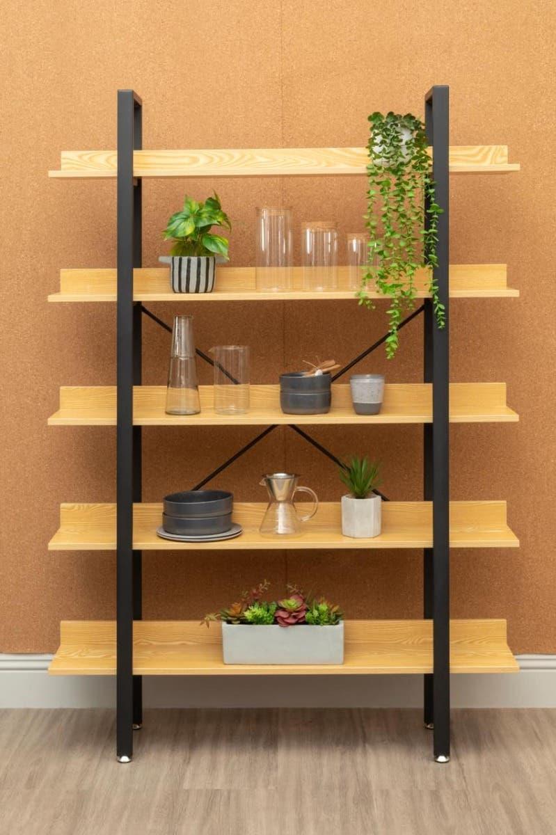 Modern wood and metal shelving unit with plants, vases, and home decor items