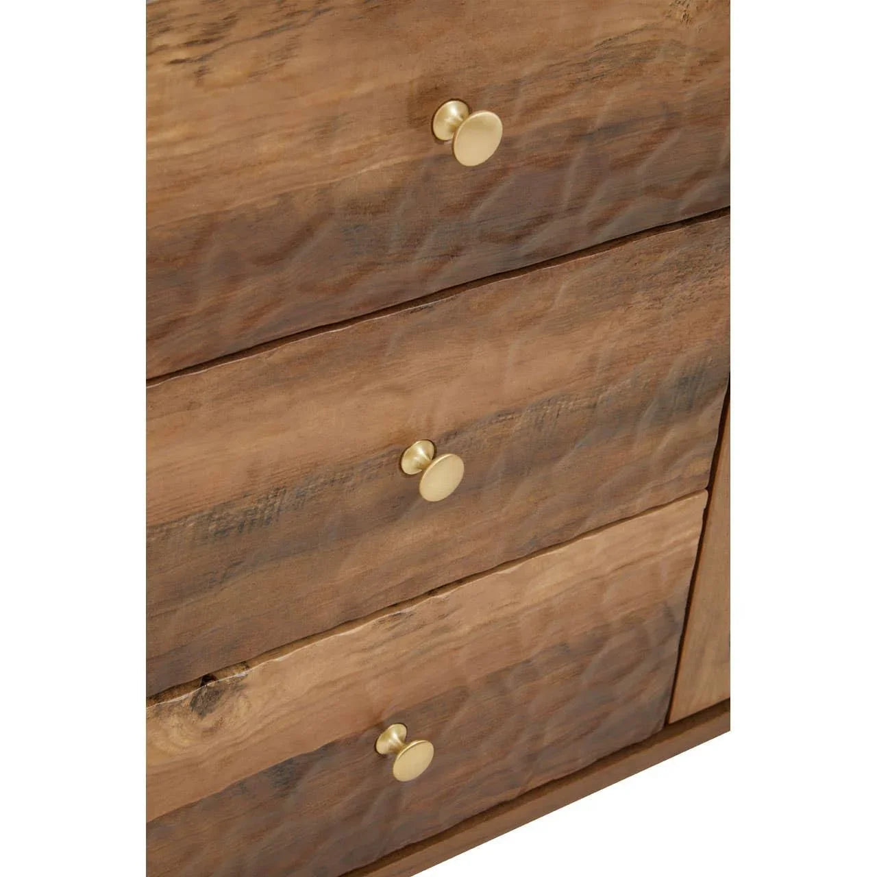 Close up of wooden chest of drawers with gold metal handles and textured finish