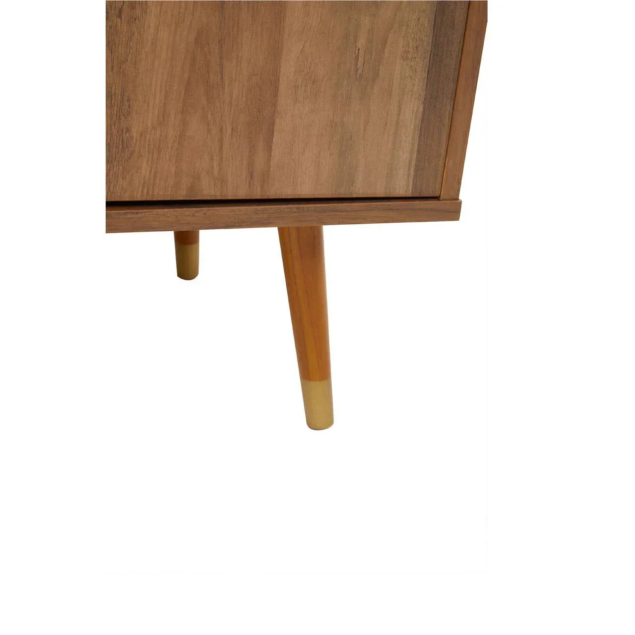 Close-up of wooden furniture leg with tapered gold tip on light wood cabinet