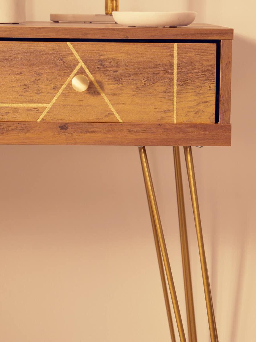 Wood console table with gold metal legs and geometric drawer detail