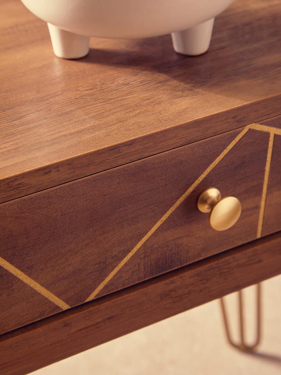 Walnut finish bedside table with gold handle and geometric drawer design
