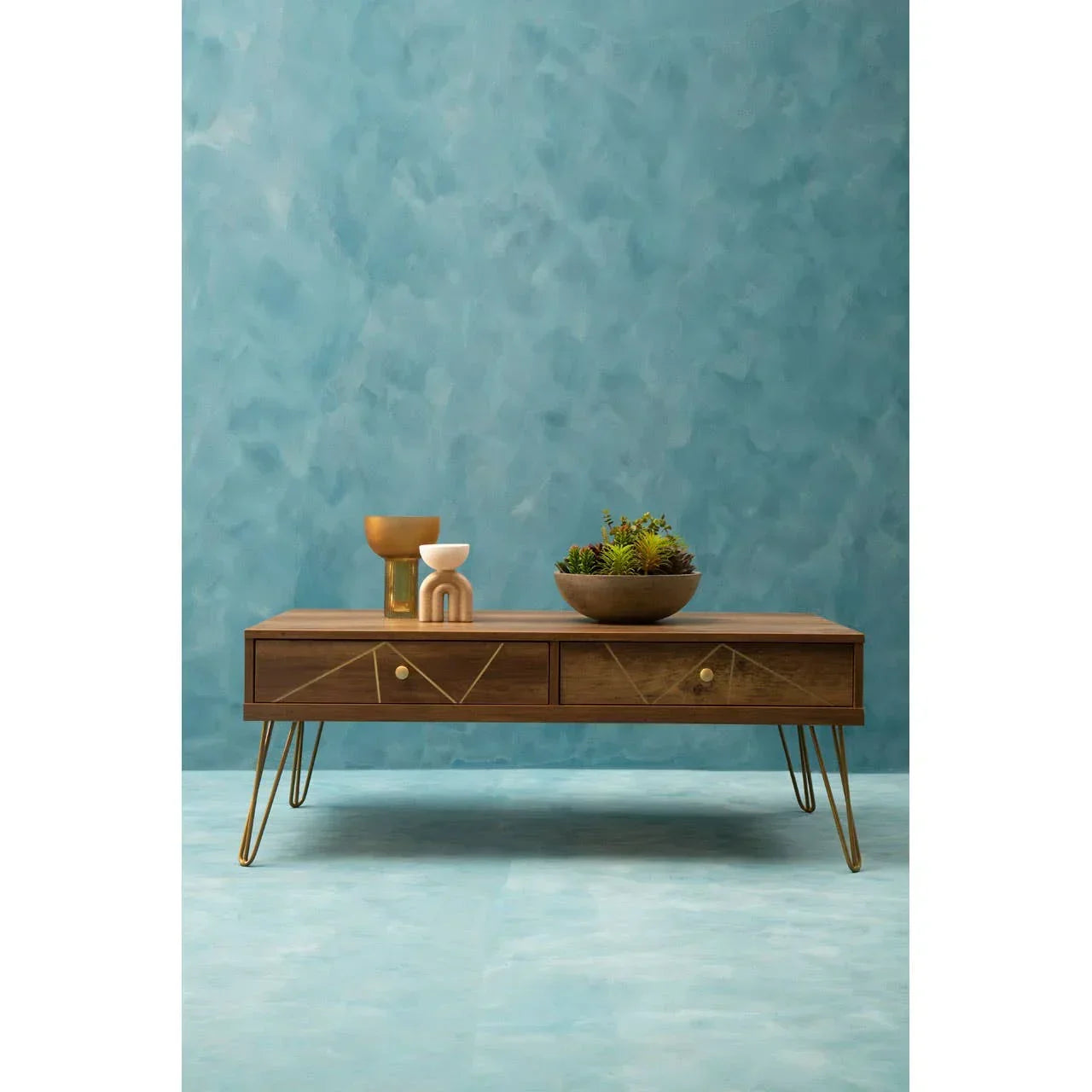Walnut coffee table with gold metal legs and drawers, styled with vases and a plant bowl