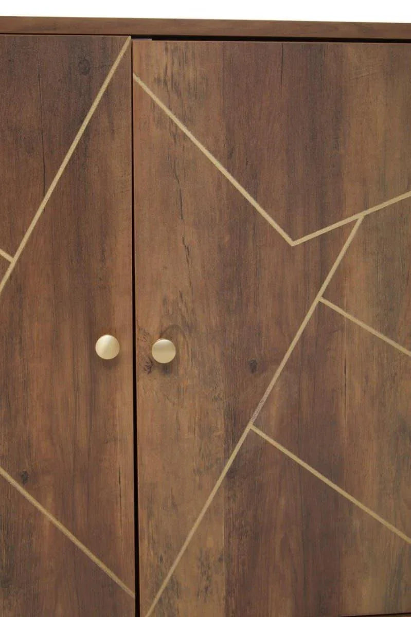 Wood cabinet doors with gold geometric lines and round gold handles, closeup view