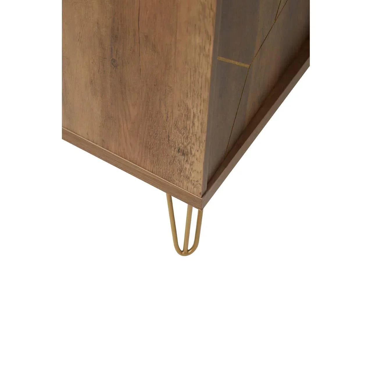 Close view of wooden cabinet corner with gold metal hairpin leg