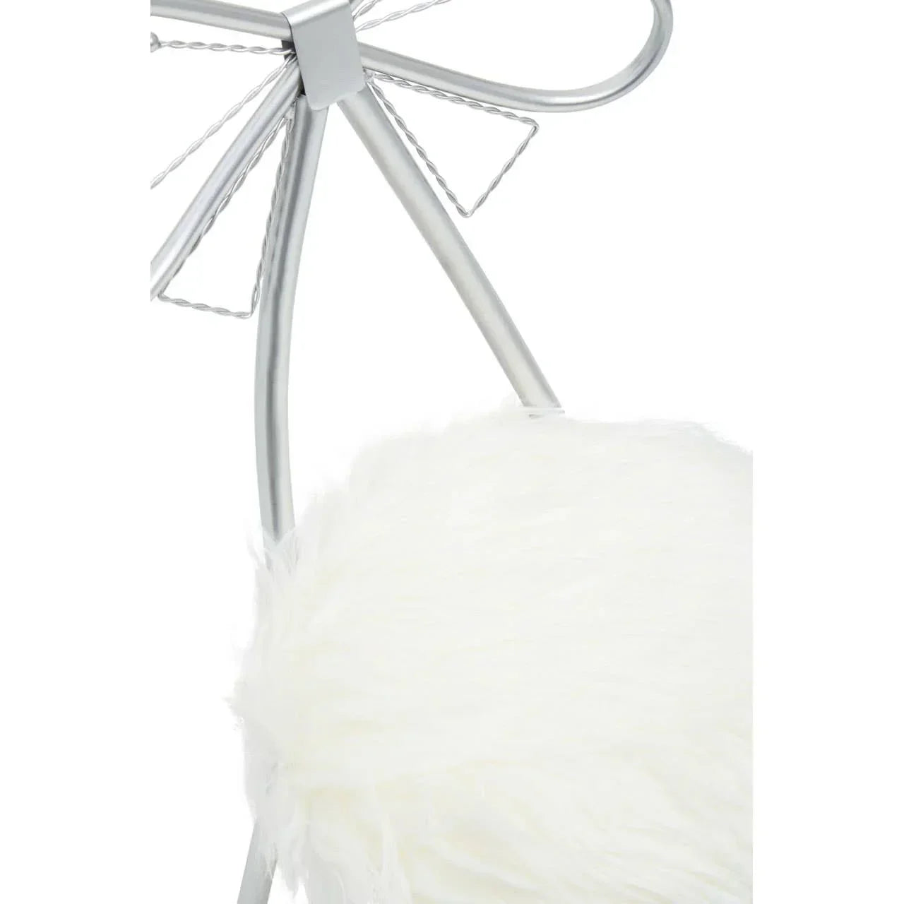 Silver metal chair with a faux fur white cushion and decorative backrest detail