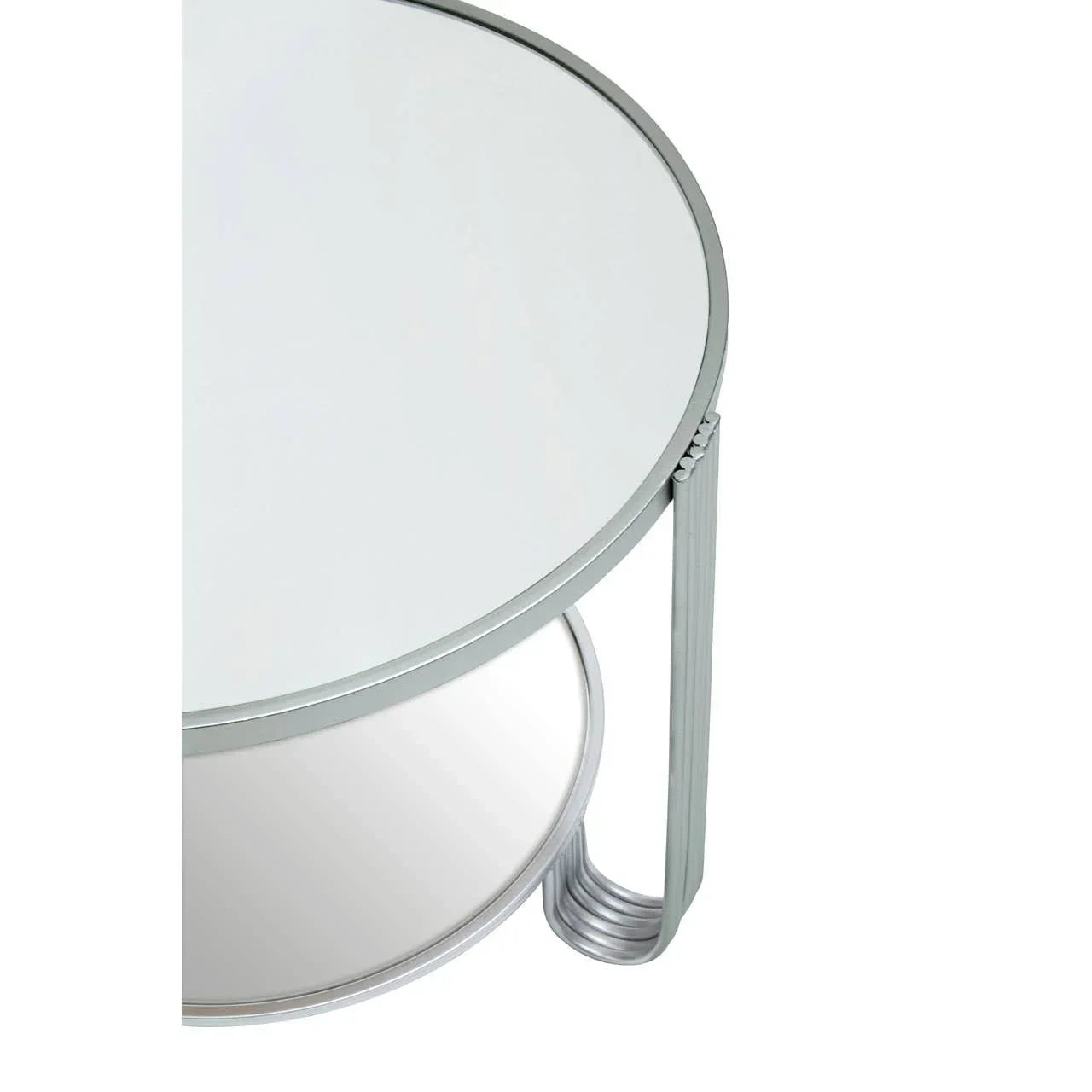 Round glass coffee table with silver metal legs and lower shelf, partial overhead view