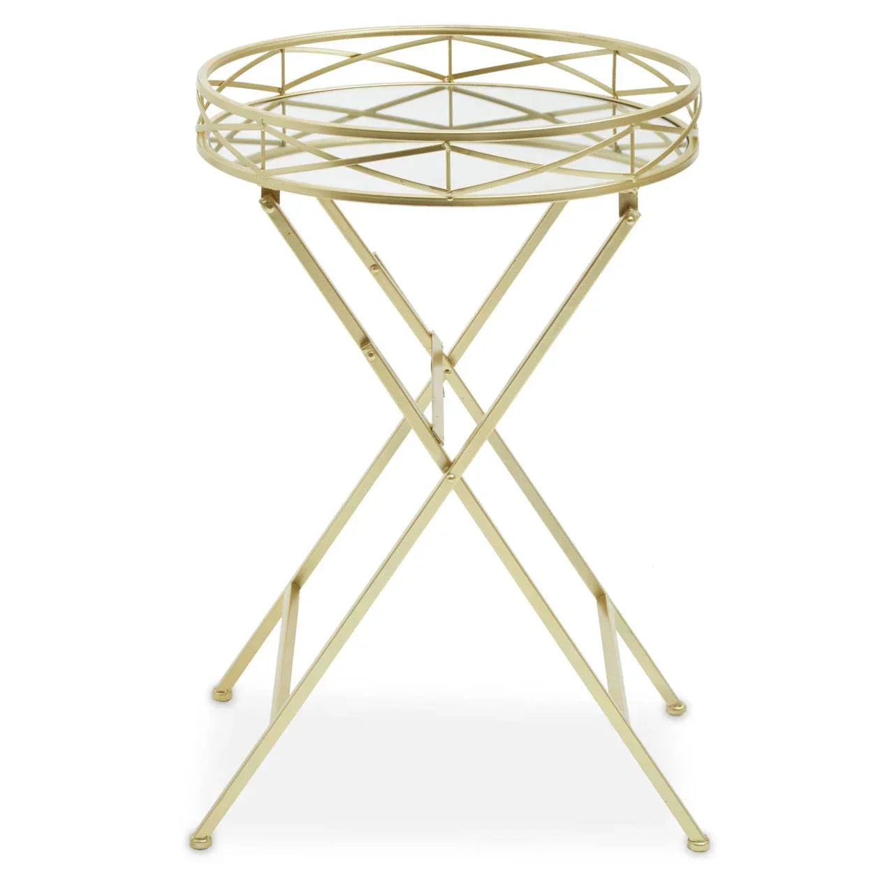 Gold metal side table with round glass top and geometric frame on crossed legs