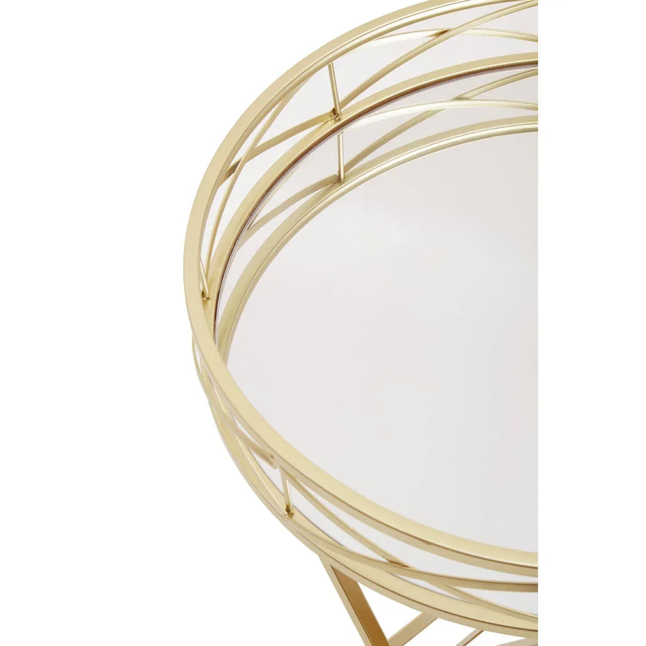Round gold metal side table with glass top, close view of frame and detailing