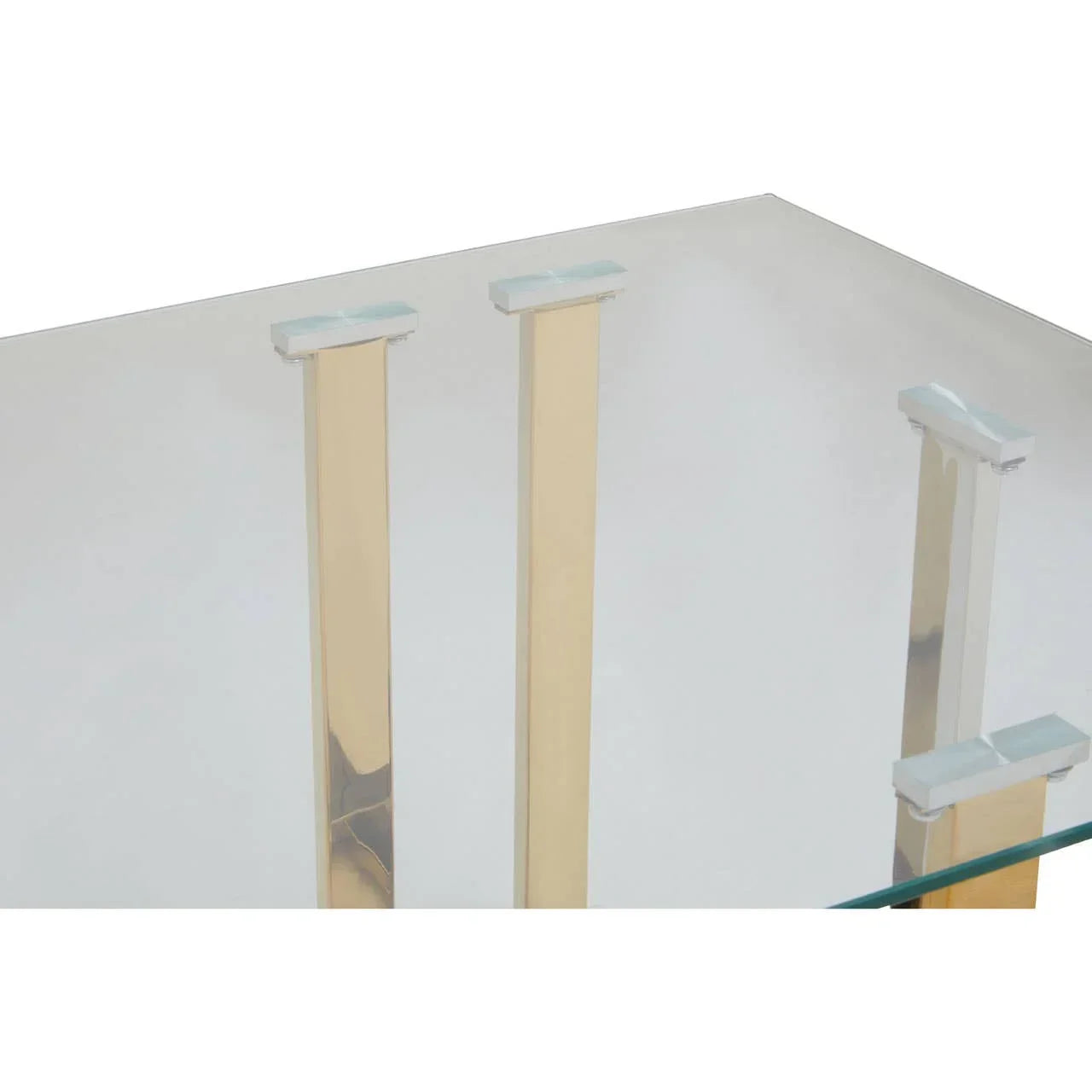 Glass coffee table with gold metal legs and clear protective pads on corners