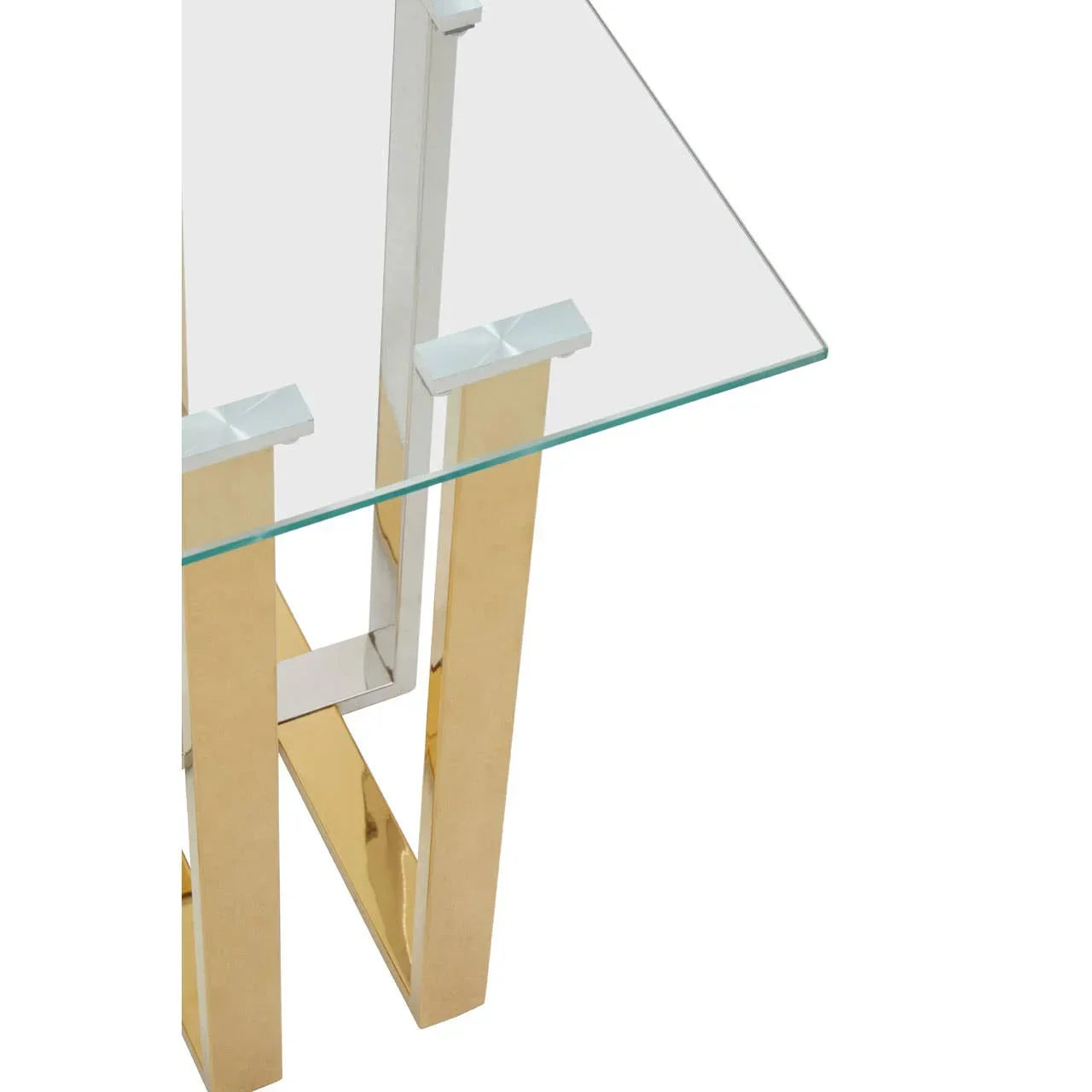 Glass top dining table with gold and chrome legs, shown from a corner angle