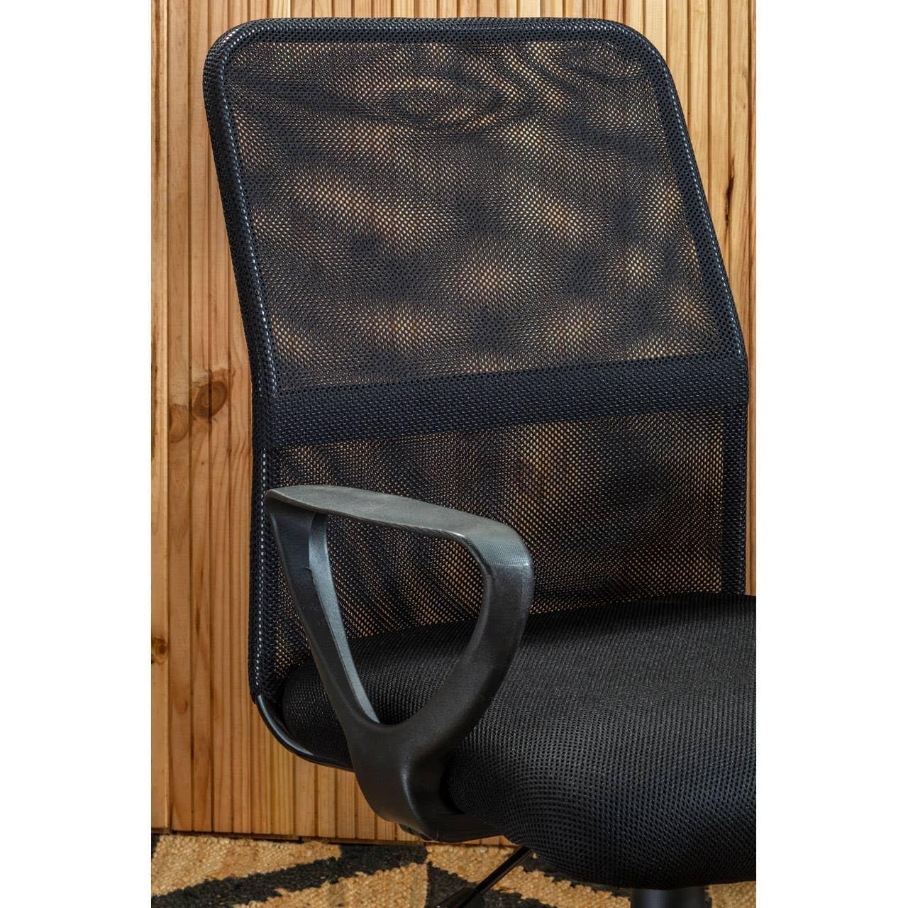 Black mesh office chair with armrest and wooden panel backdrop