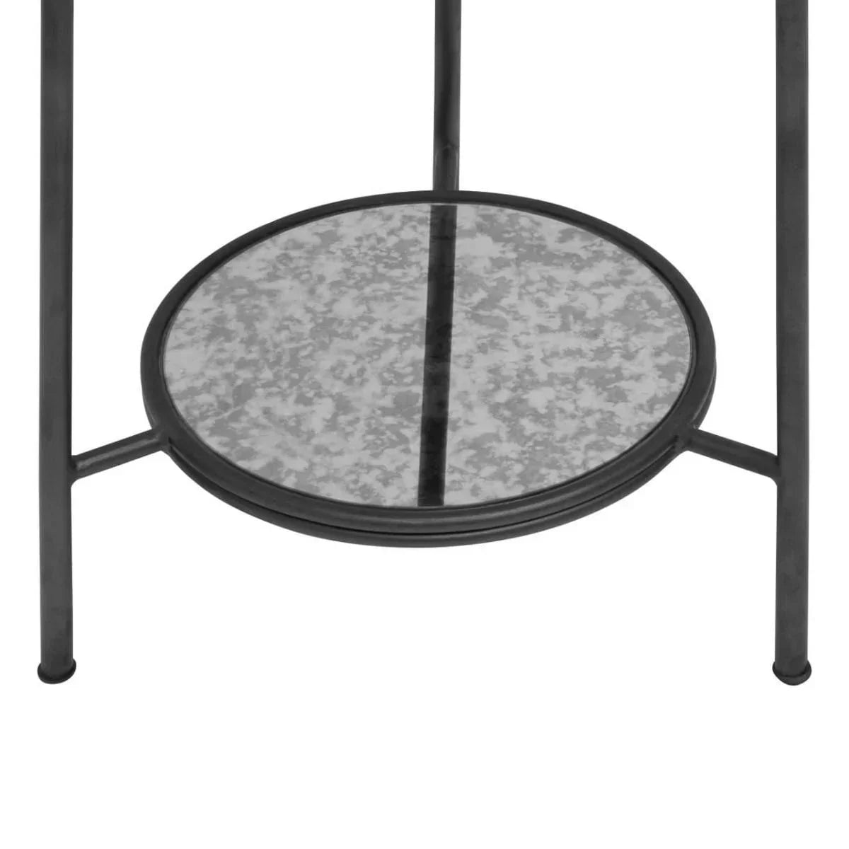 Round metal side table with lower mirrored shelf and black frame, close-up view