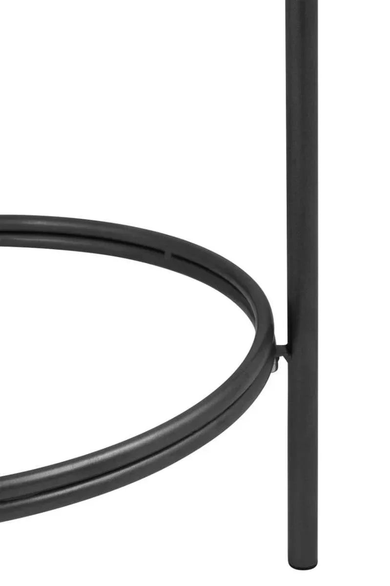 Black metal table frame with circular support ring, close-up of furniture leg detail