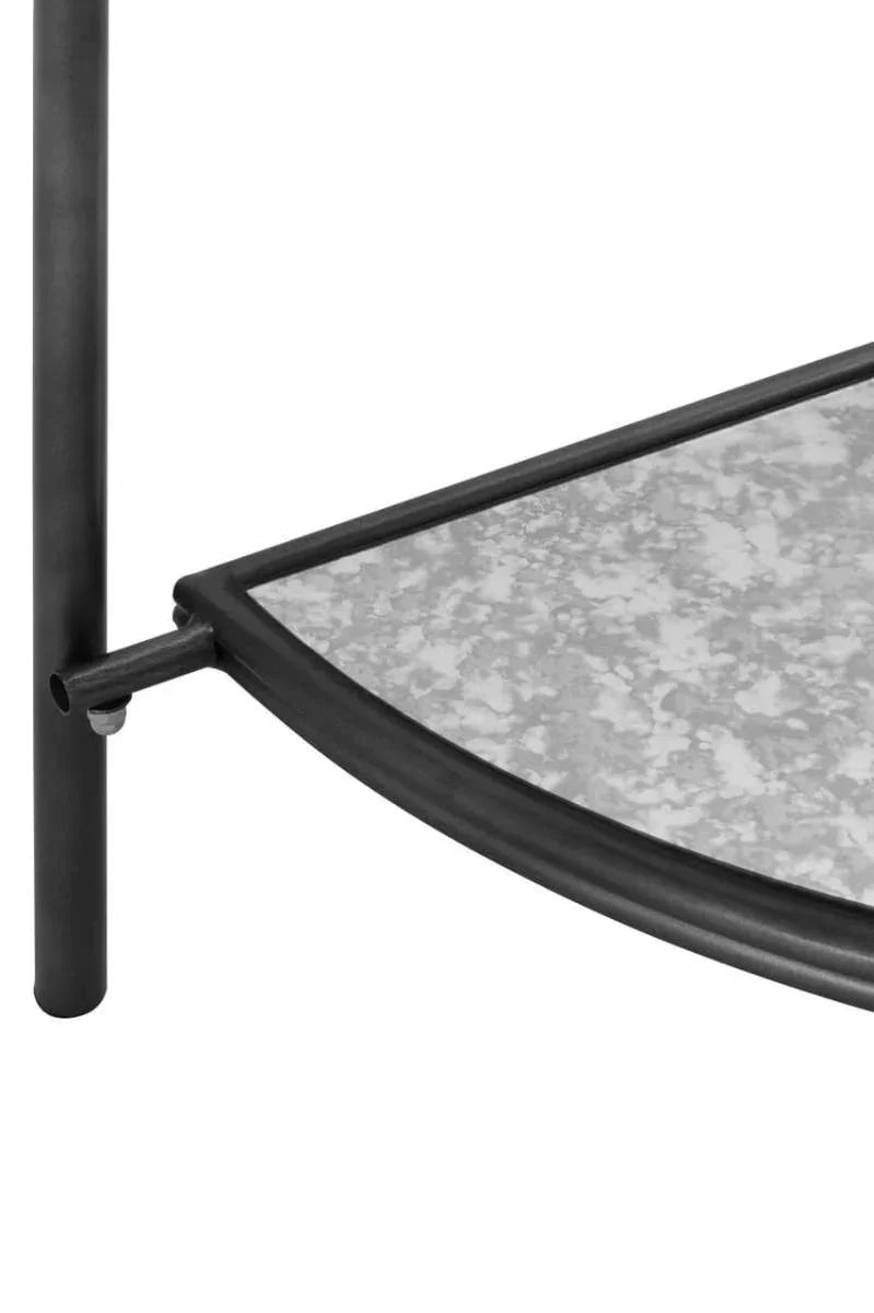 Closeup of a metal frame and glass shelf corner on a contemporary furniture piece