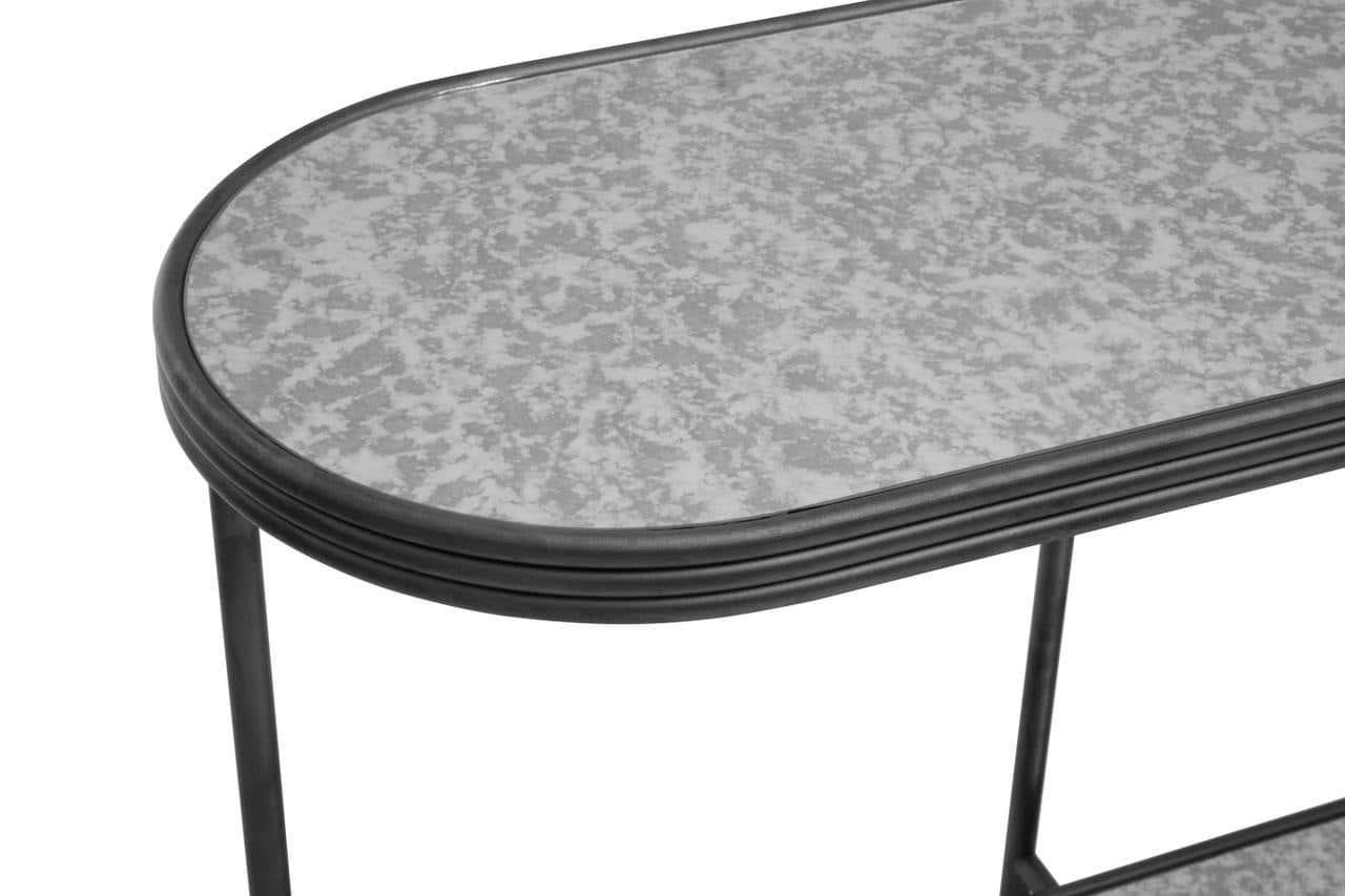Oval console table with metal frame and grey mottled glass top, close view