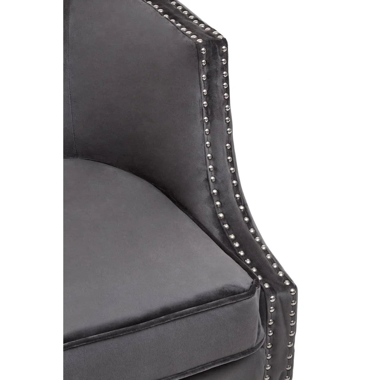 Charcoal velvet armchair with silver stud detailing and plush cushion, close side view