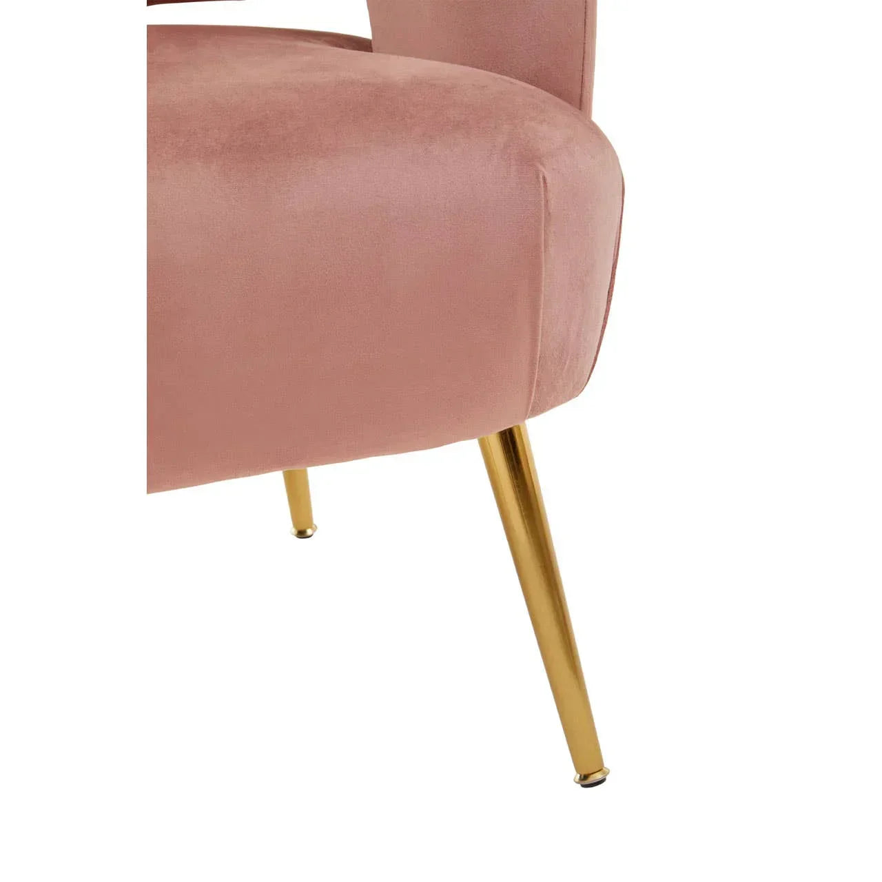 Velvet accent chair in blush pink with gold metal legs, close-up of seat and legs