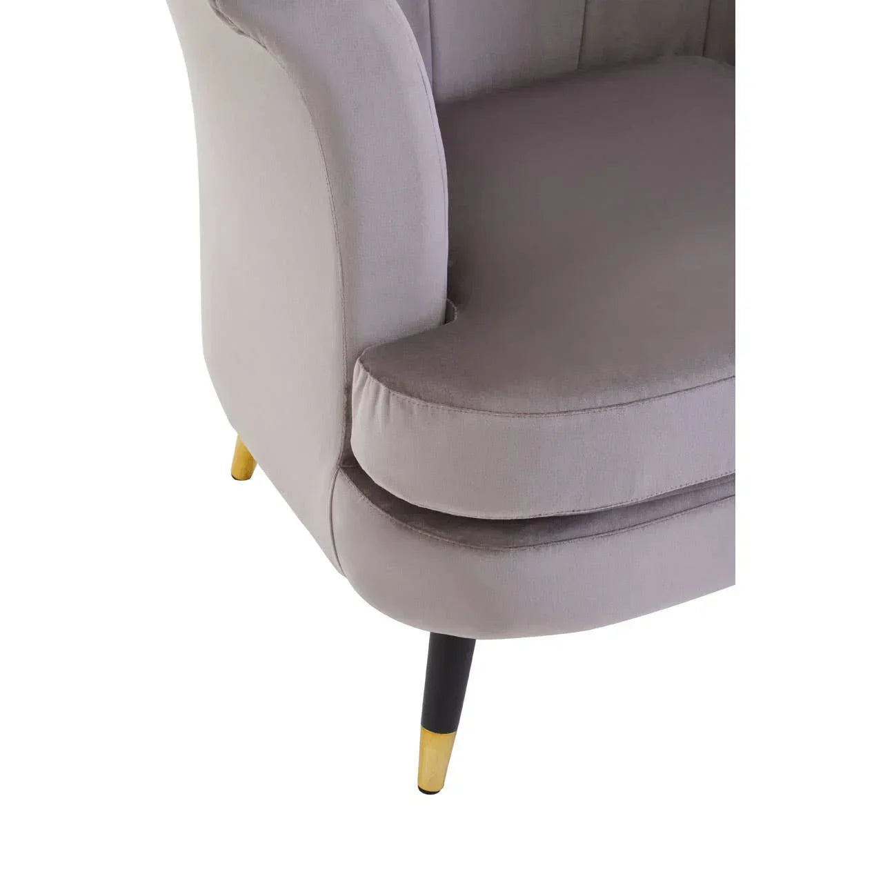 Grey fabric armchair close-up with gold-tipped black legs and plush seat cushion