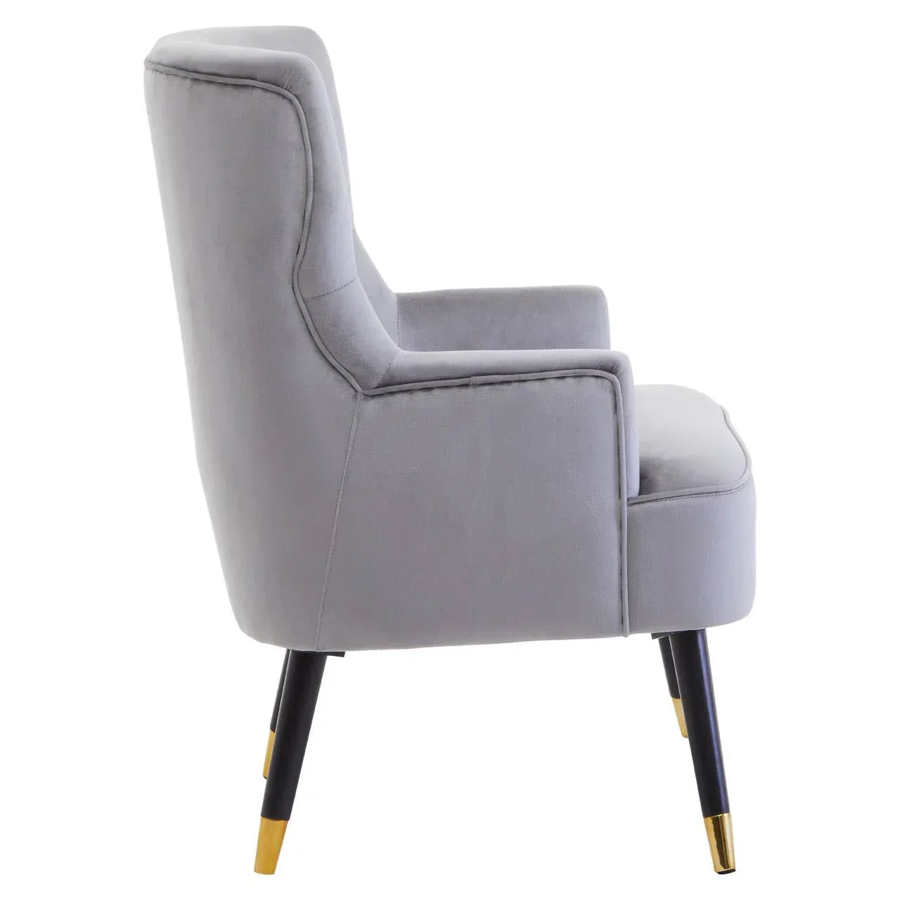 Light grey accent chair with black and gold legs, side profile view