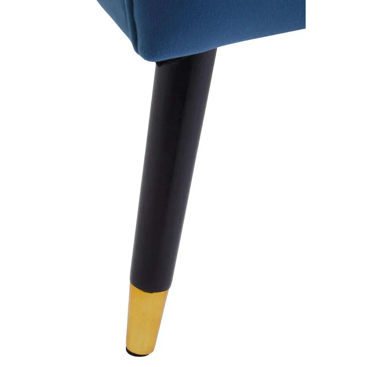 Blue upholstered sofa leg with black and gold metal finish, close-up angle