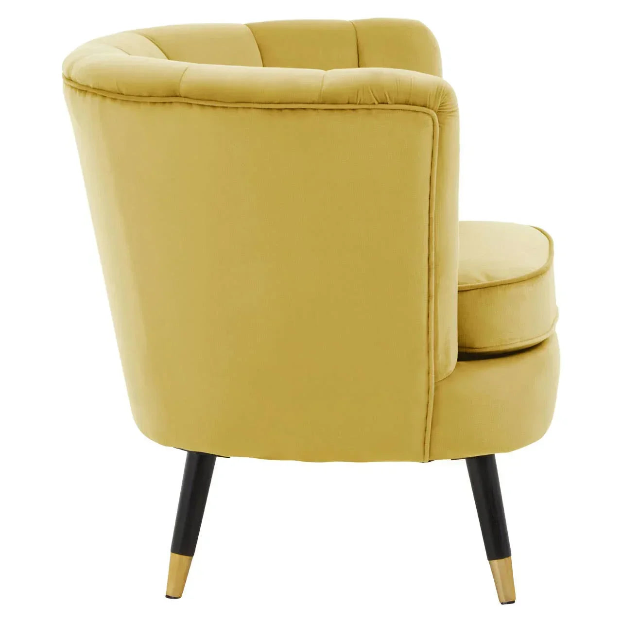 Yellow velvet accent chair with curved backrest and black tapered legs, rear angle view