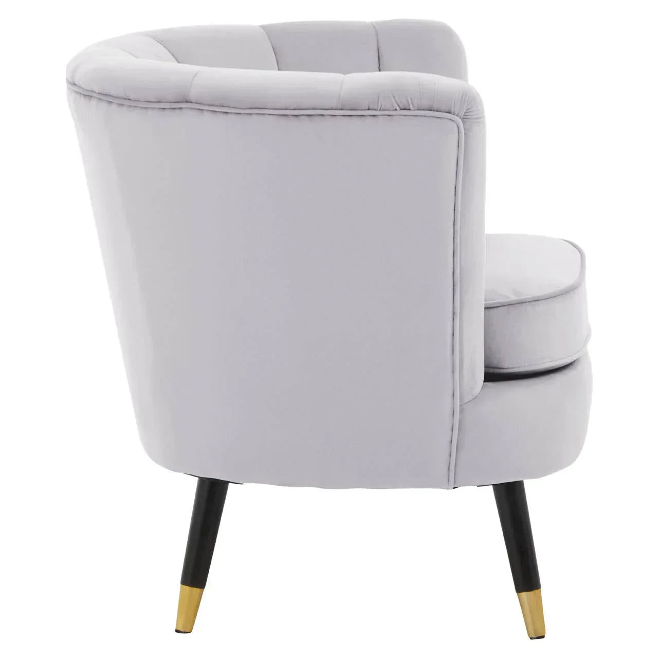 Rear view of grey velvet accent chair with black and gold tapered legs