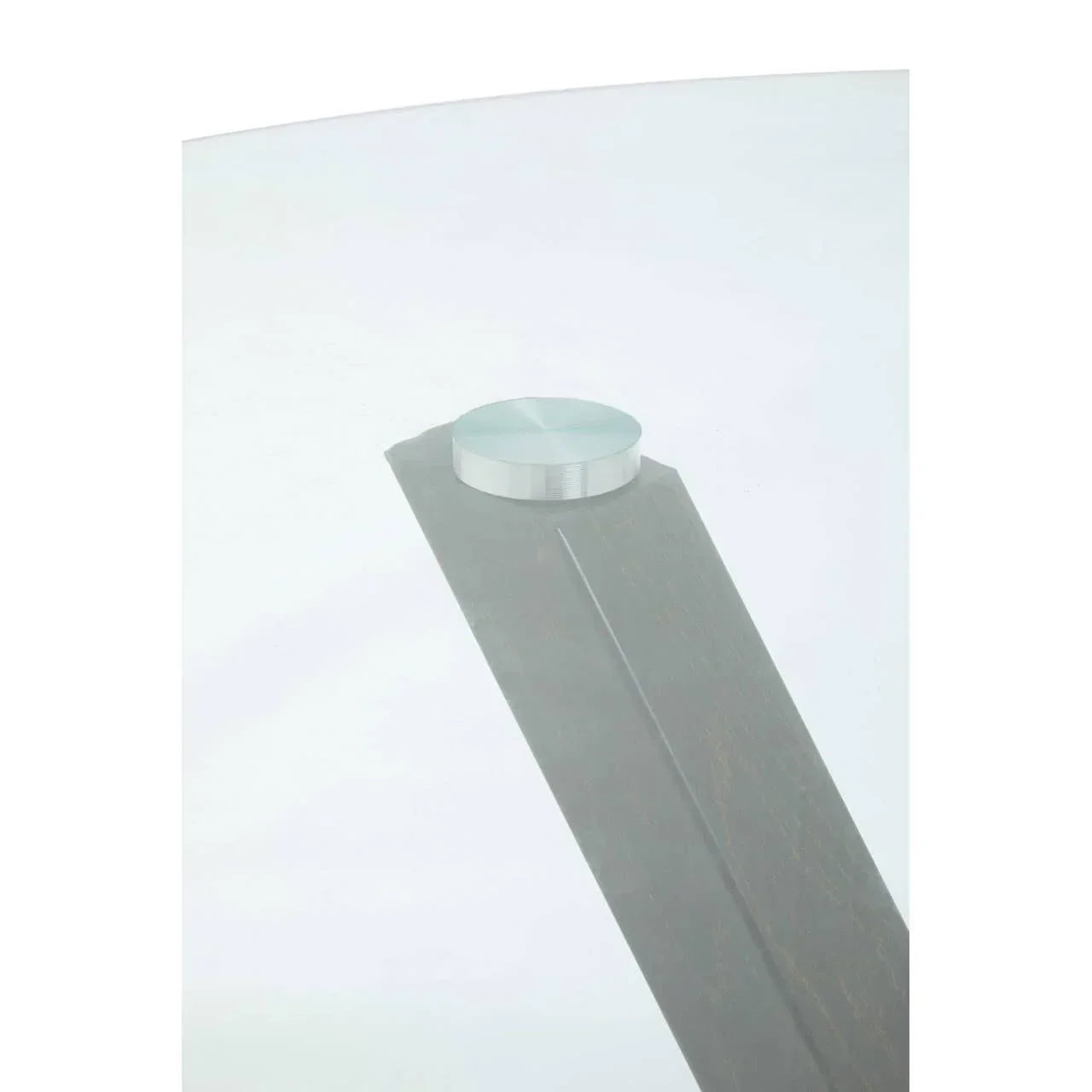 Close-up of glass top dining table corner with metal connector and wooden leg