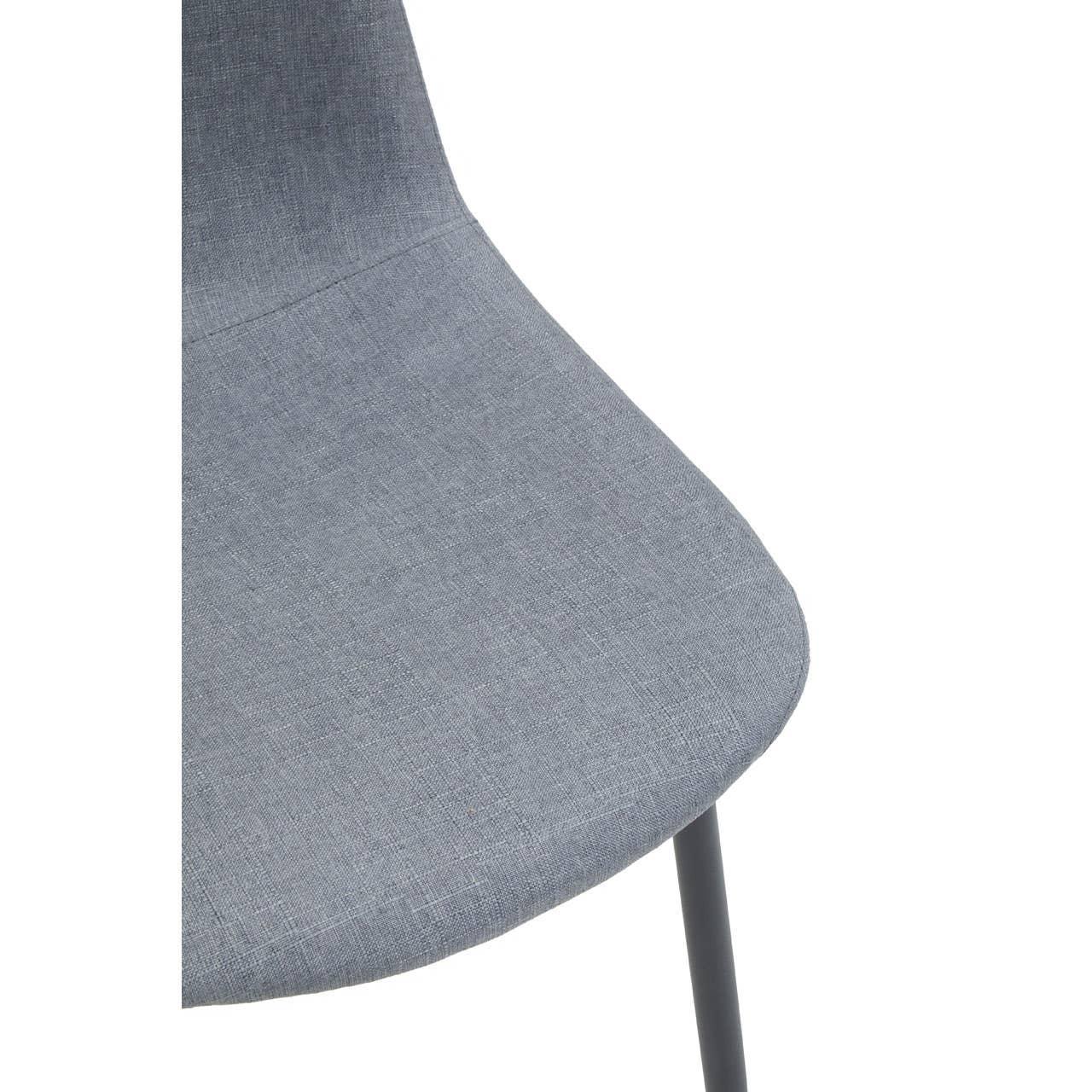 Grey fabric dining chair seat with slim black leg, close-up view