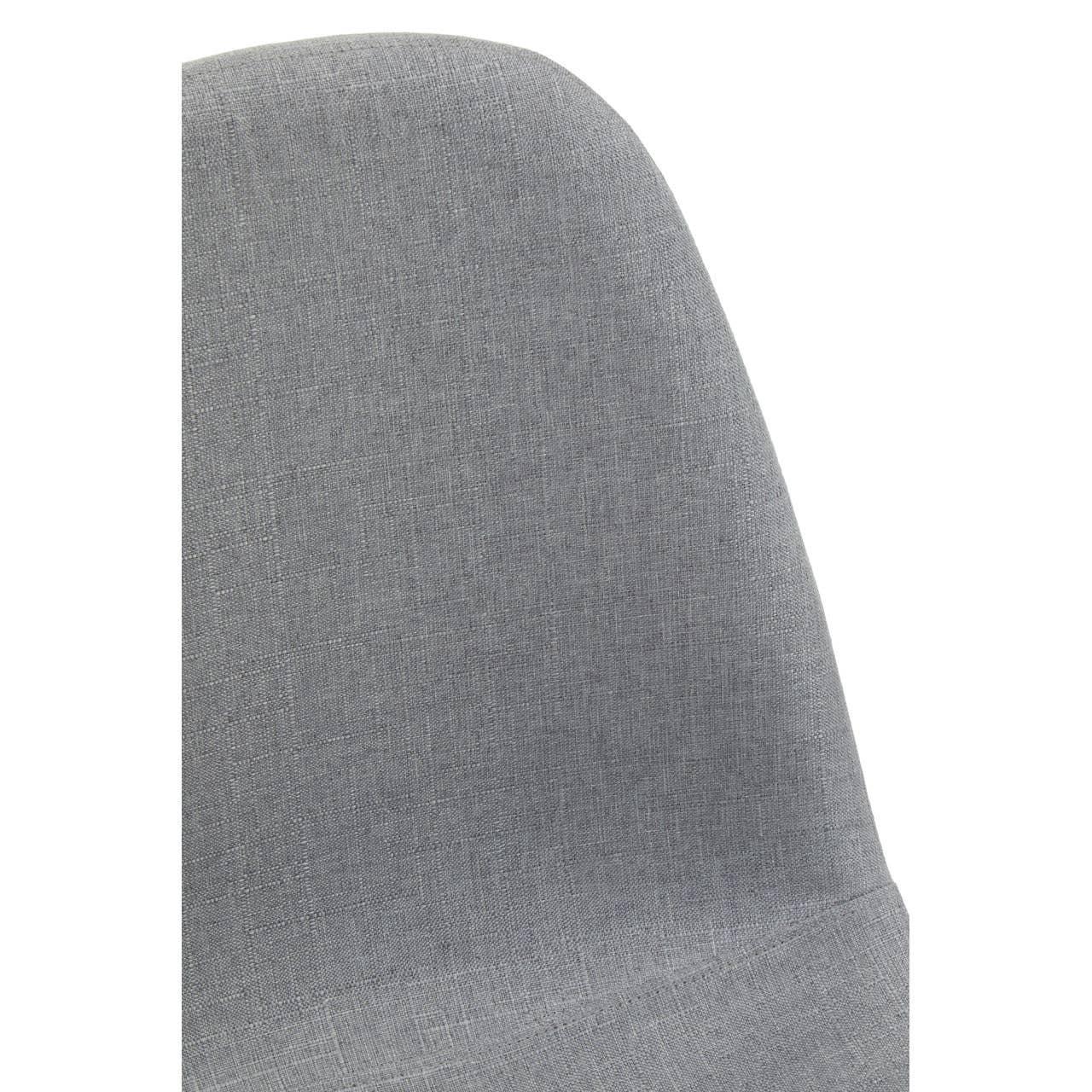 Closeup of grey fabric dining chair backrest with smooth upholstery