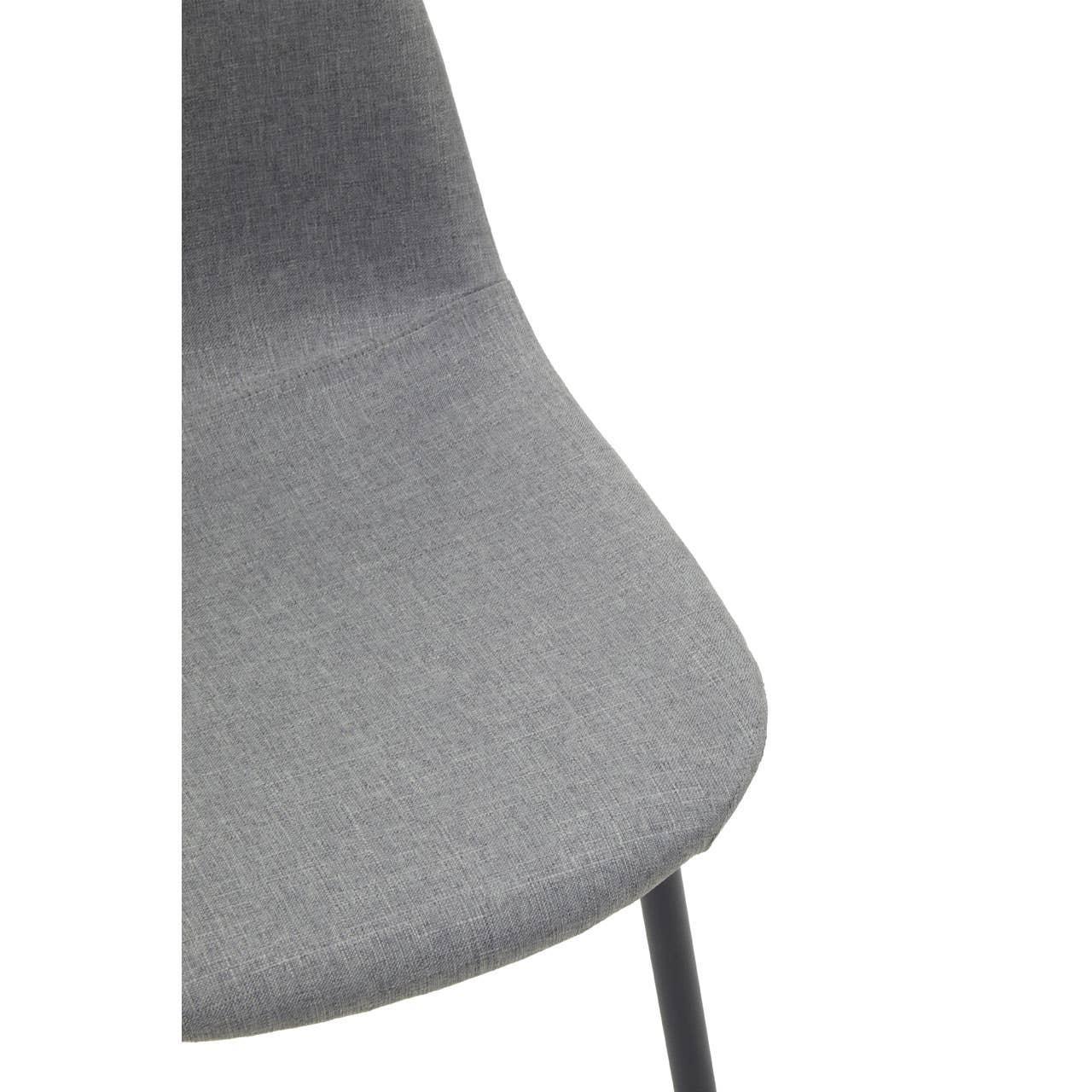 Closeup of modern grey fabric dining chair with black leg
