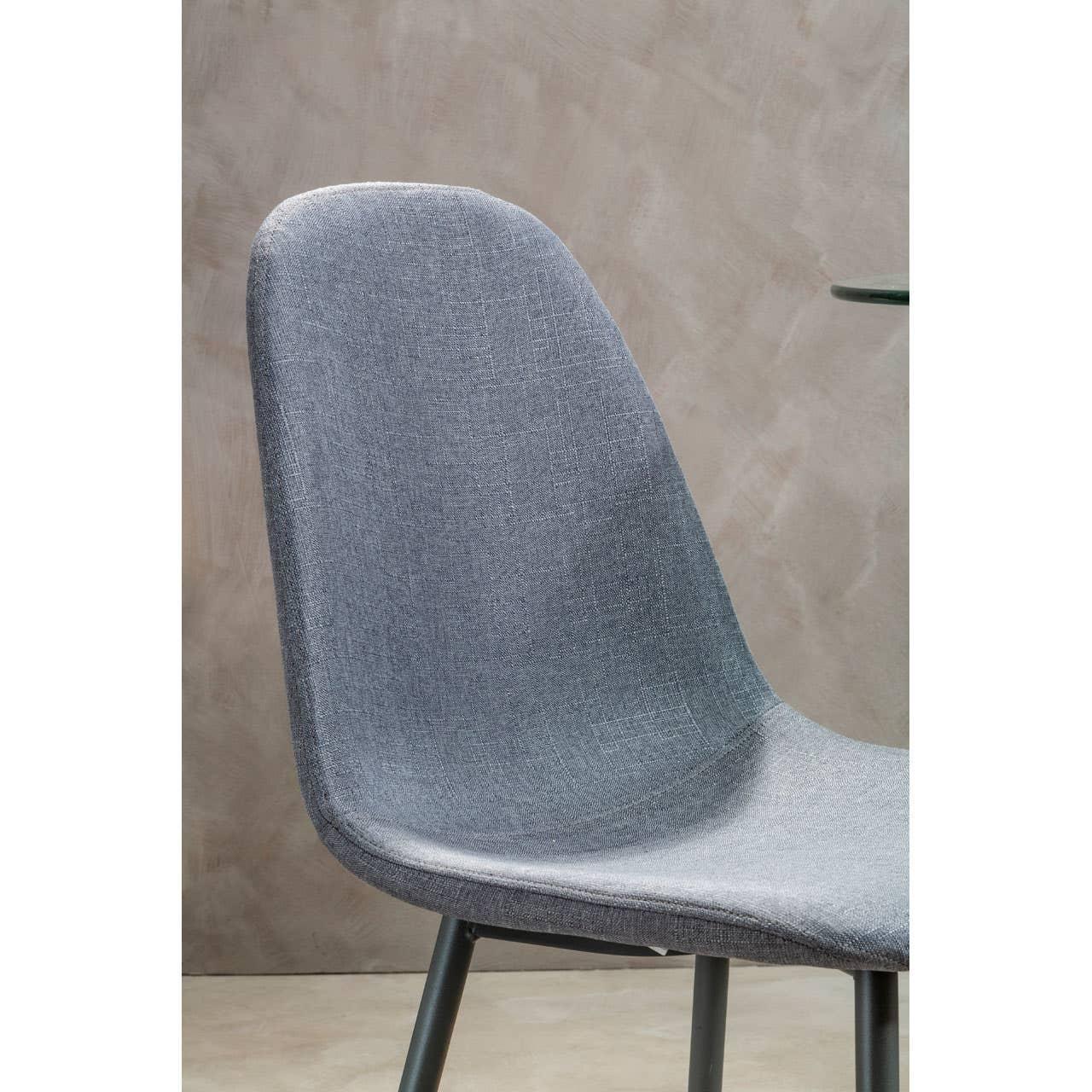 Grey upholstered dining chair with curved back and angled legs